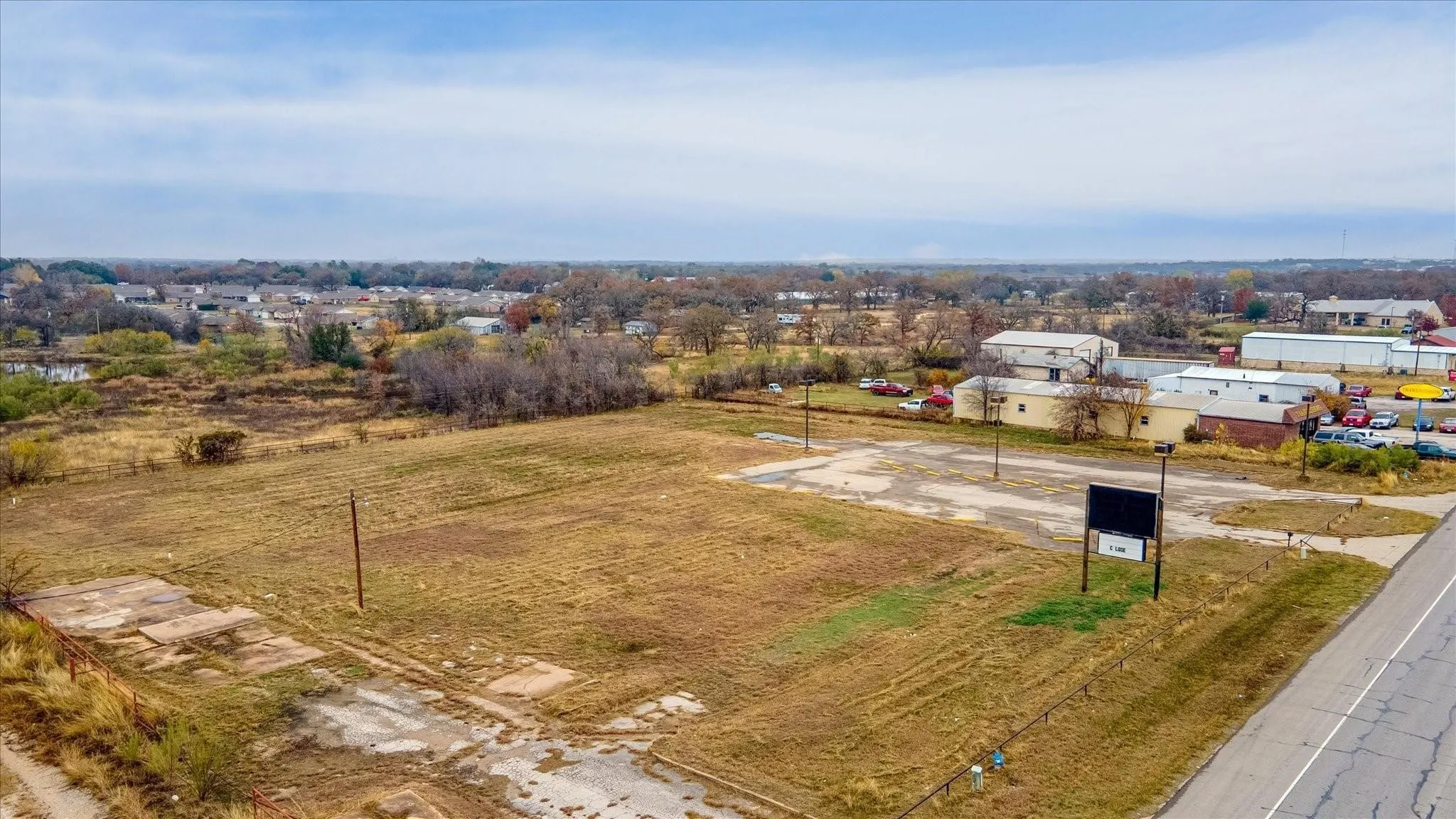 Expansive commercial lot featuring a clear, level terrain with direct road frontage