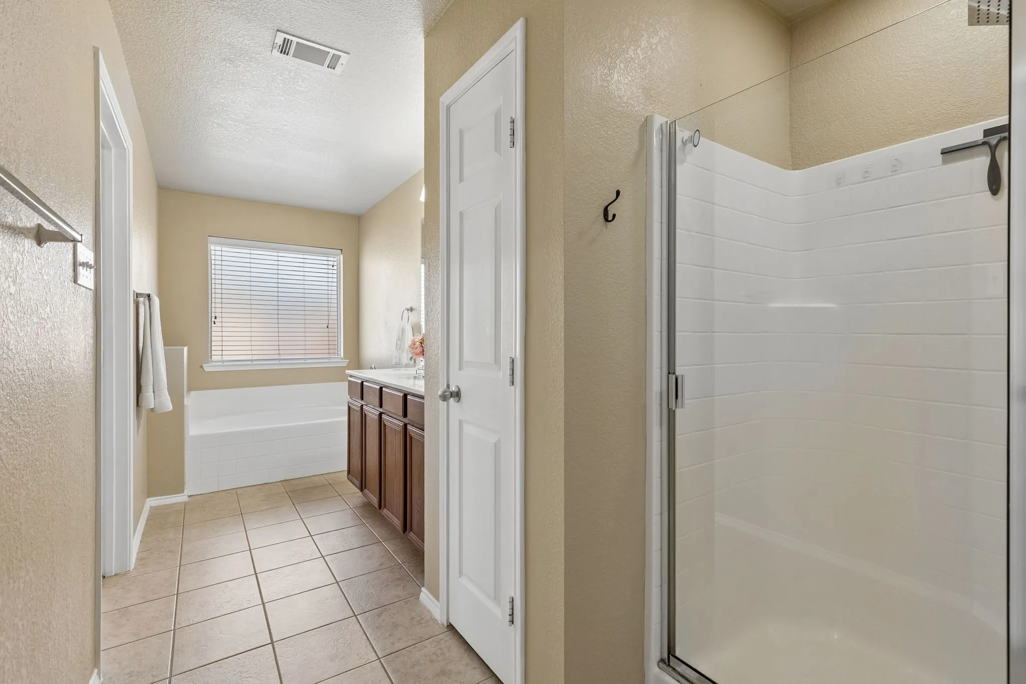 Primary bathroom with garden tub, double sinks and walk-in shower