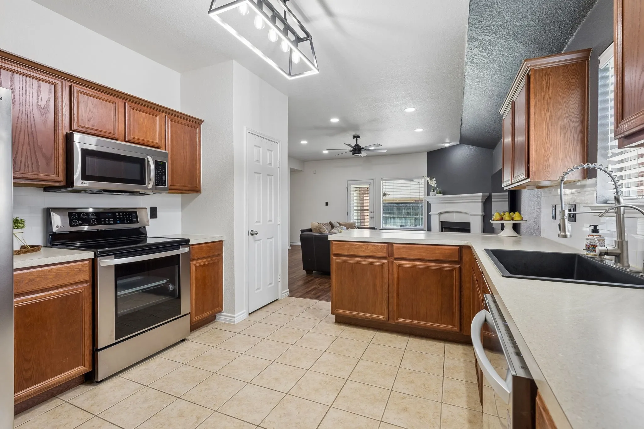 Kitchen with new sink, faucet and light fixture