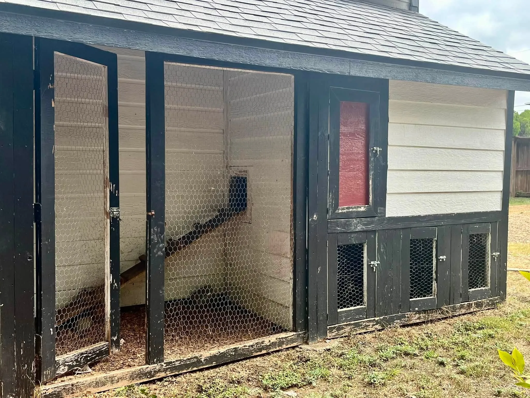 chicken coop is attached to storage building