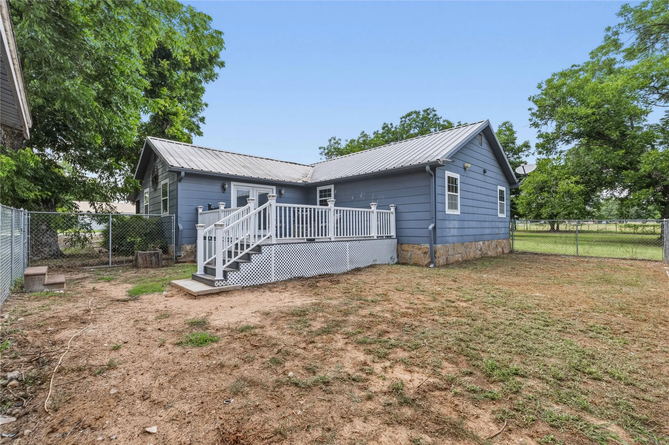 Stairs to fenced in yard for dogs
