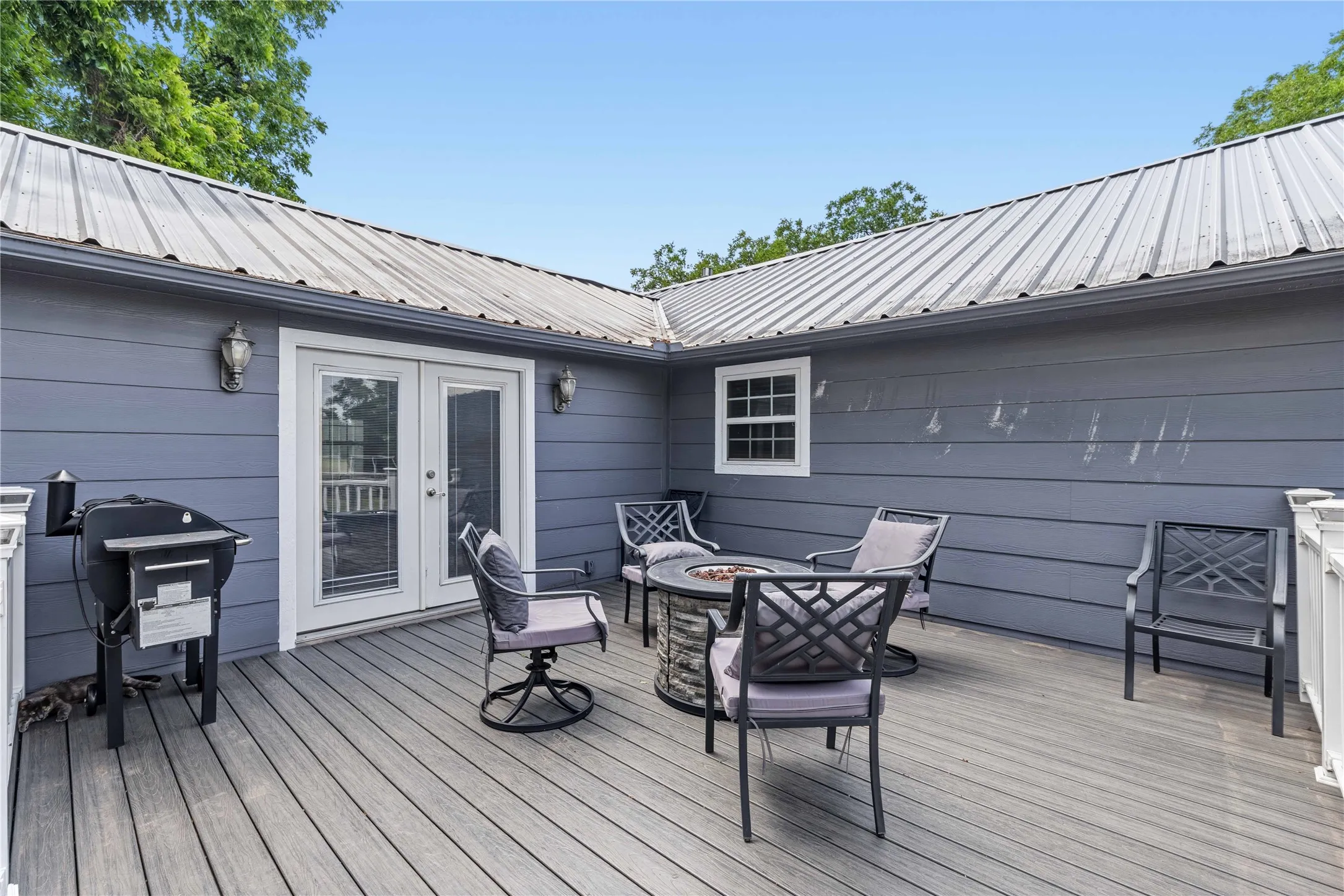 Gorgeous deck with steps away from above ground pool.