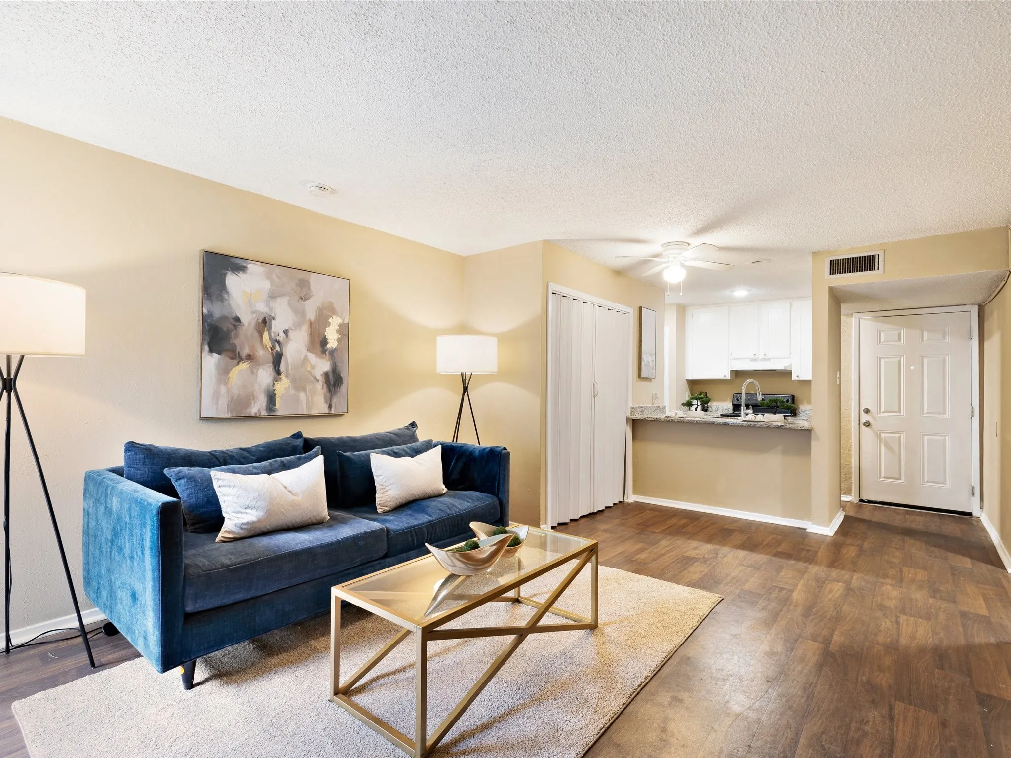Living area with wood-finish flooring and neutral wall tones
