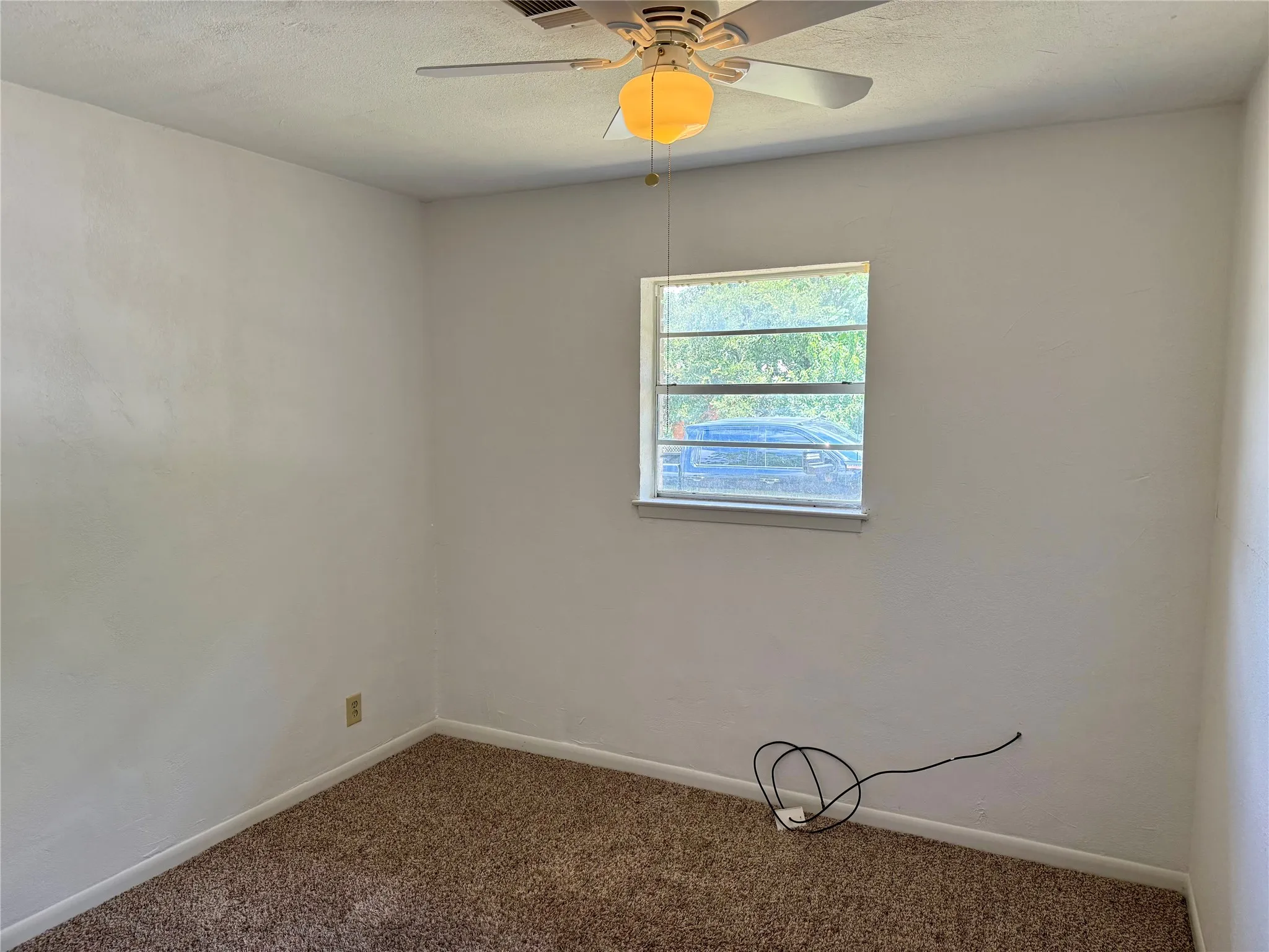 Neutral wall finishes with a single window