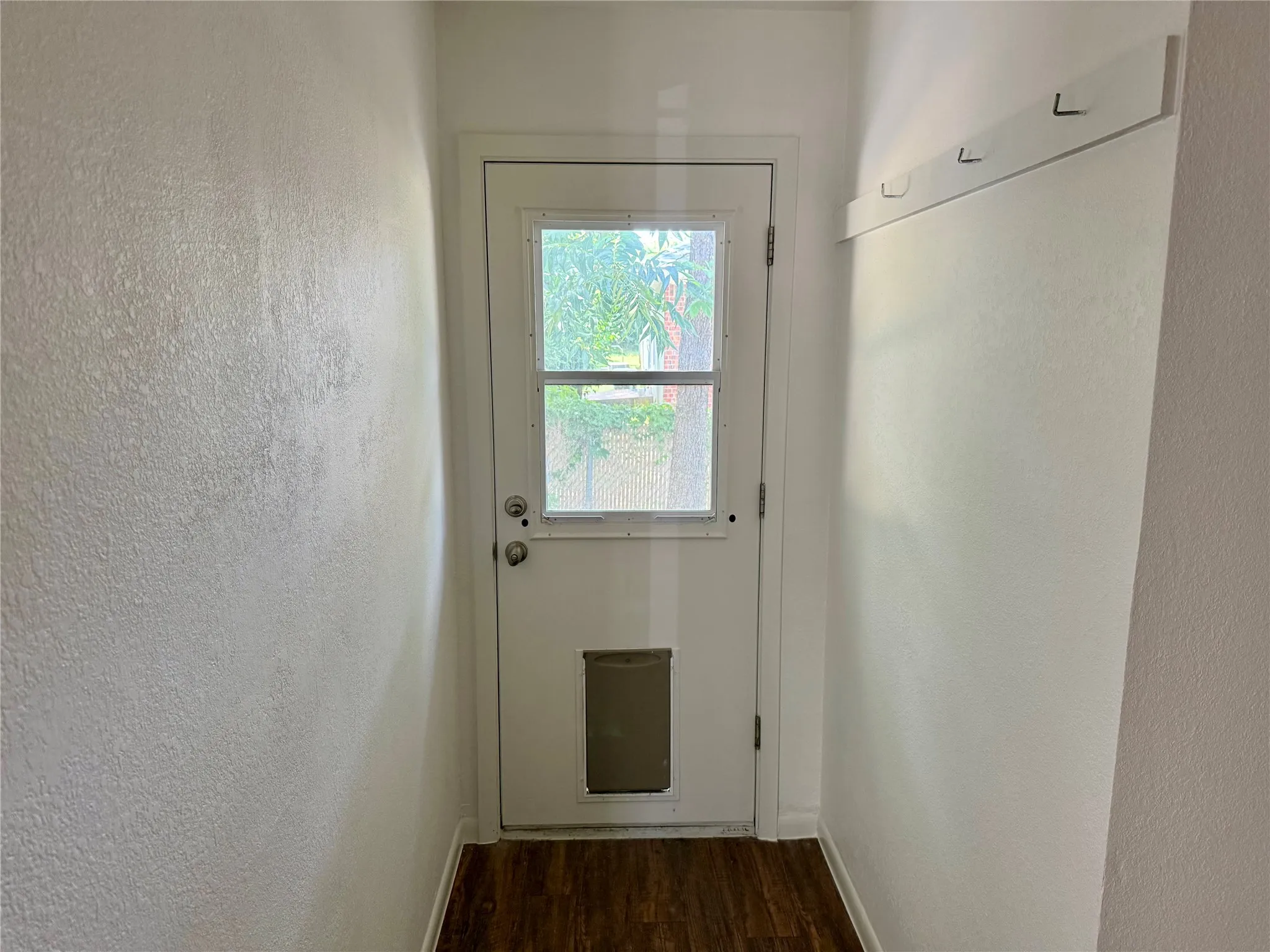 White painted door with upper and lower glass panels