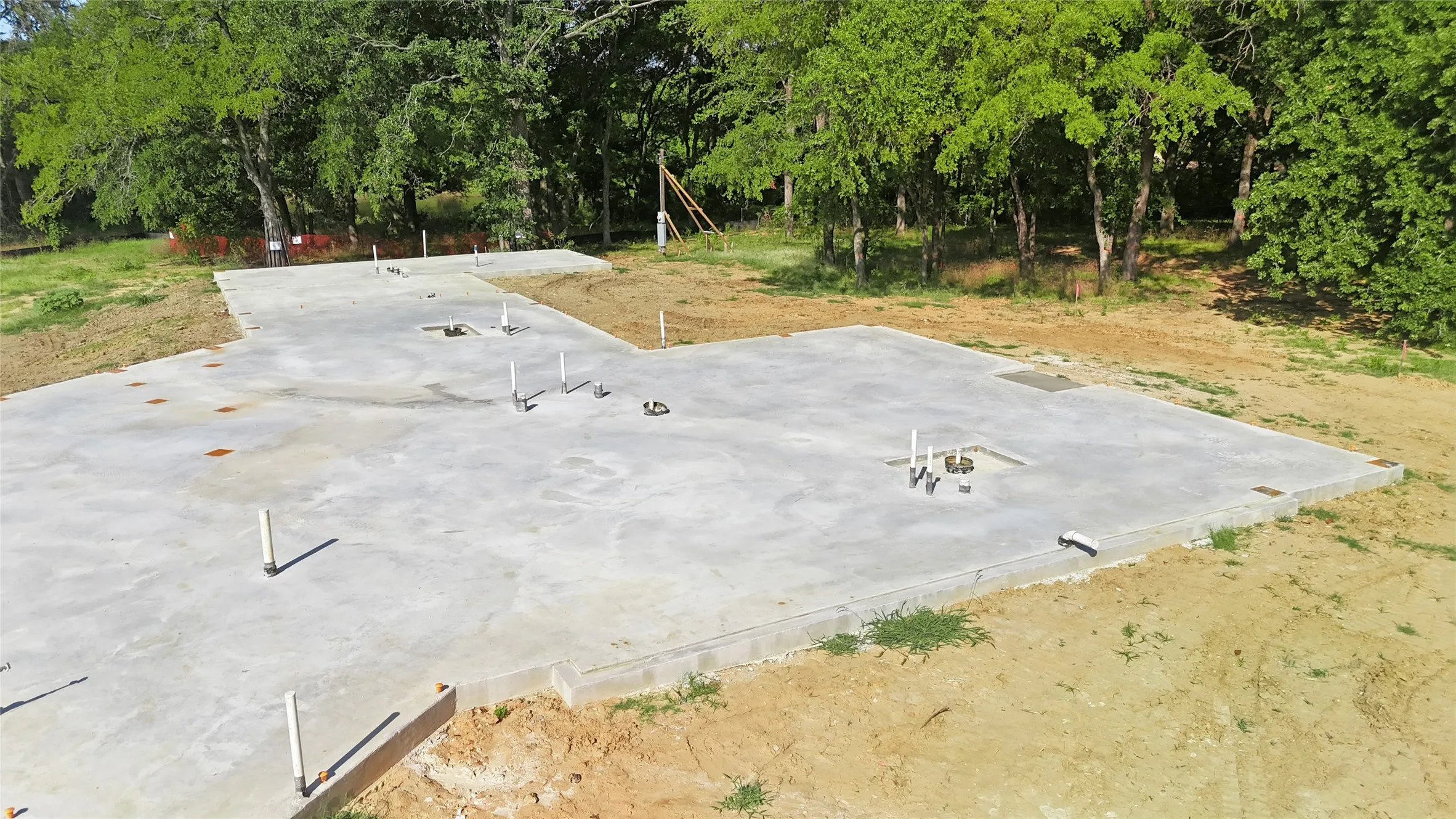 Foundation has been poured and you can utilize or pour your own.