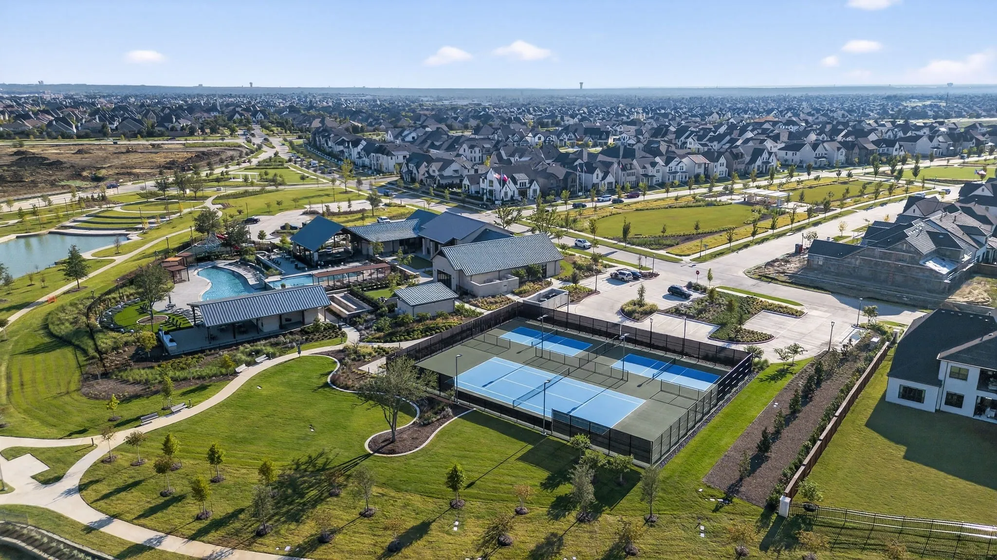 Aerial depiction of a community featuring a central amenity area