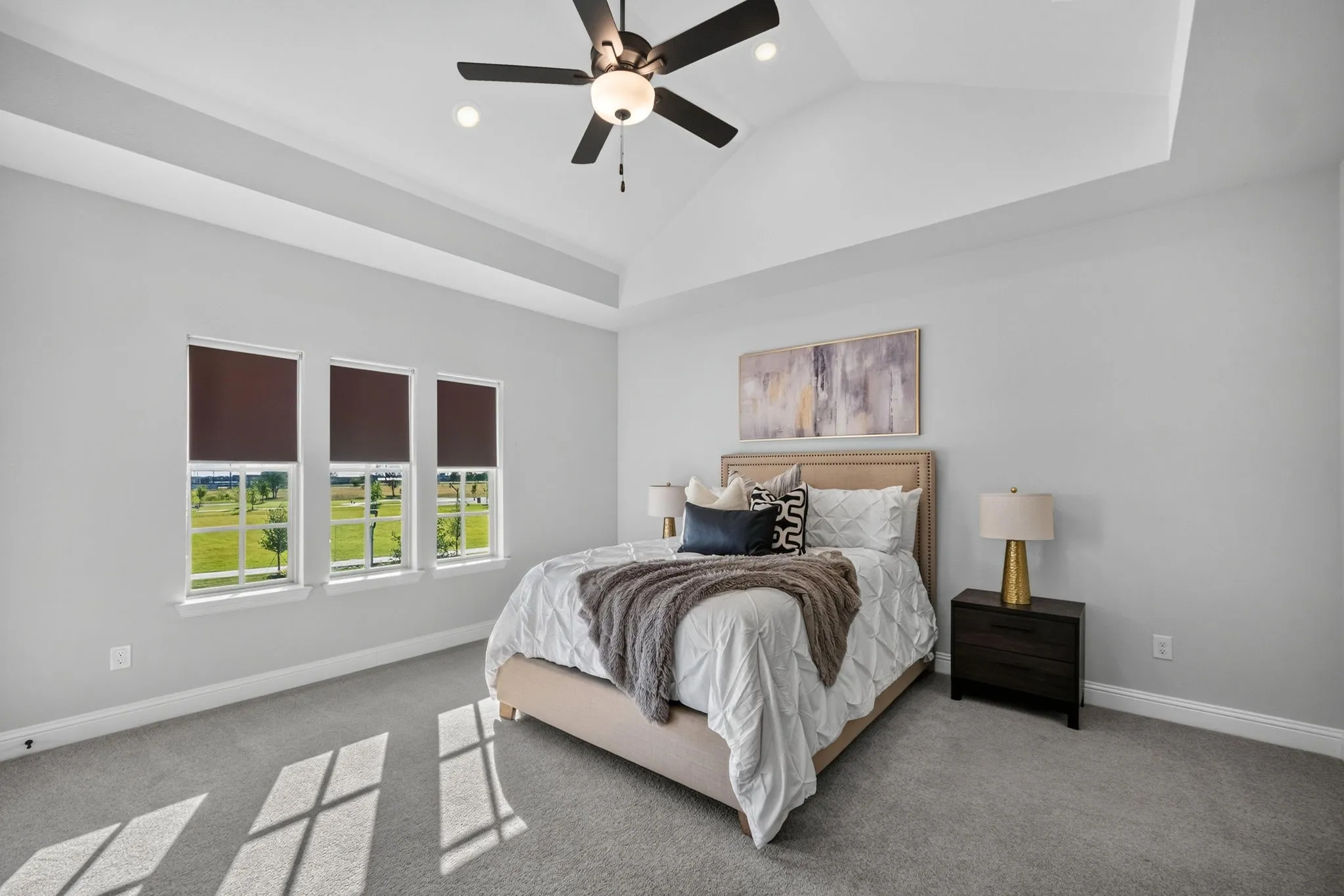 Vaulted ceiling with a flush-mount ceiling fan and integrated lighting