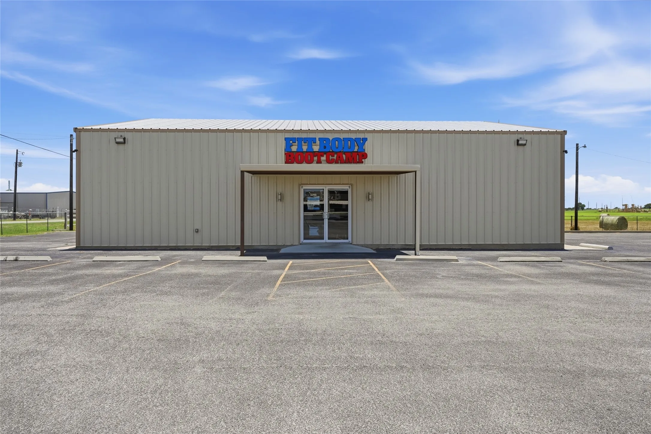 Commercial building featuring a metal facade and a metal roof