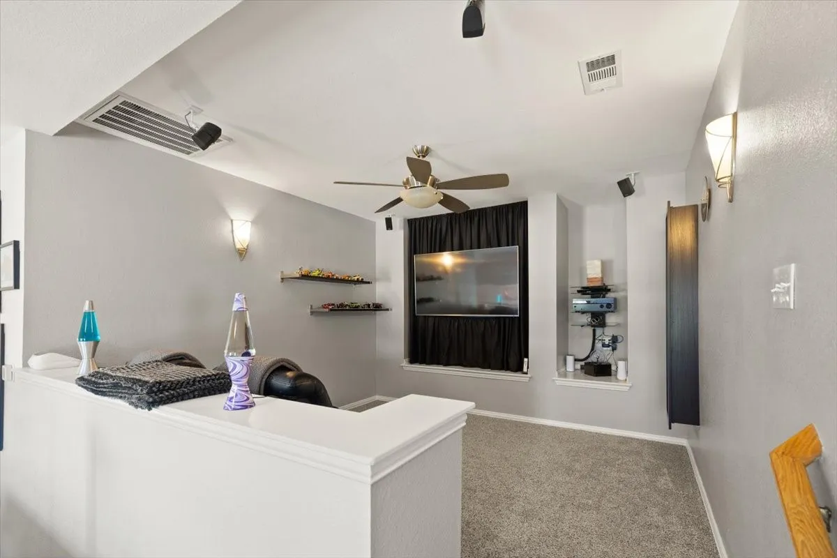 Upstairs media room in bonus space.