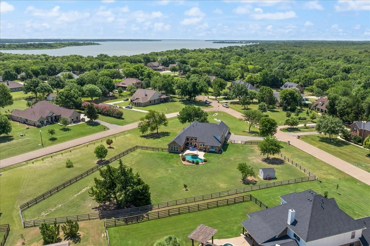 Aerial perspective showcasing a sprawling property with a private pool