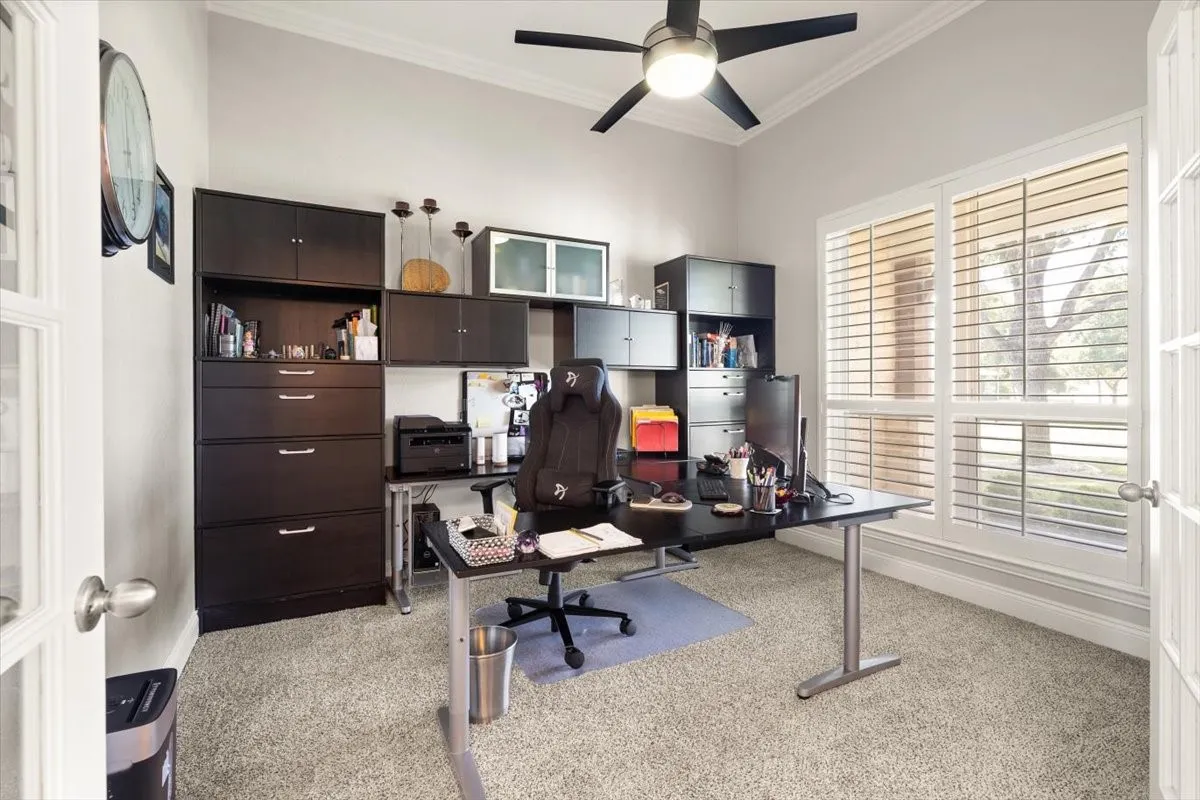 Interior space featuring vaulted ceilings and a ceiling fan with integrated lighting