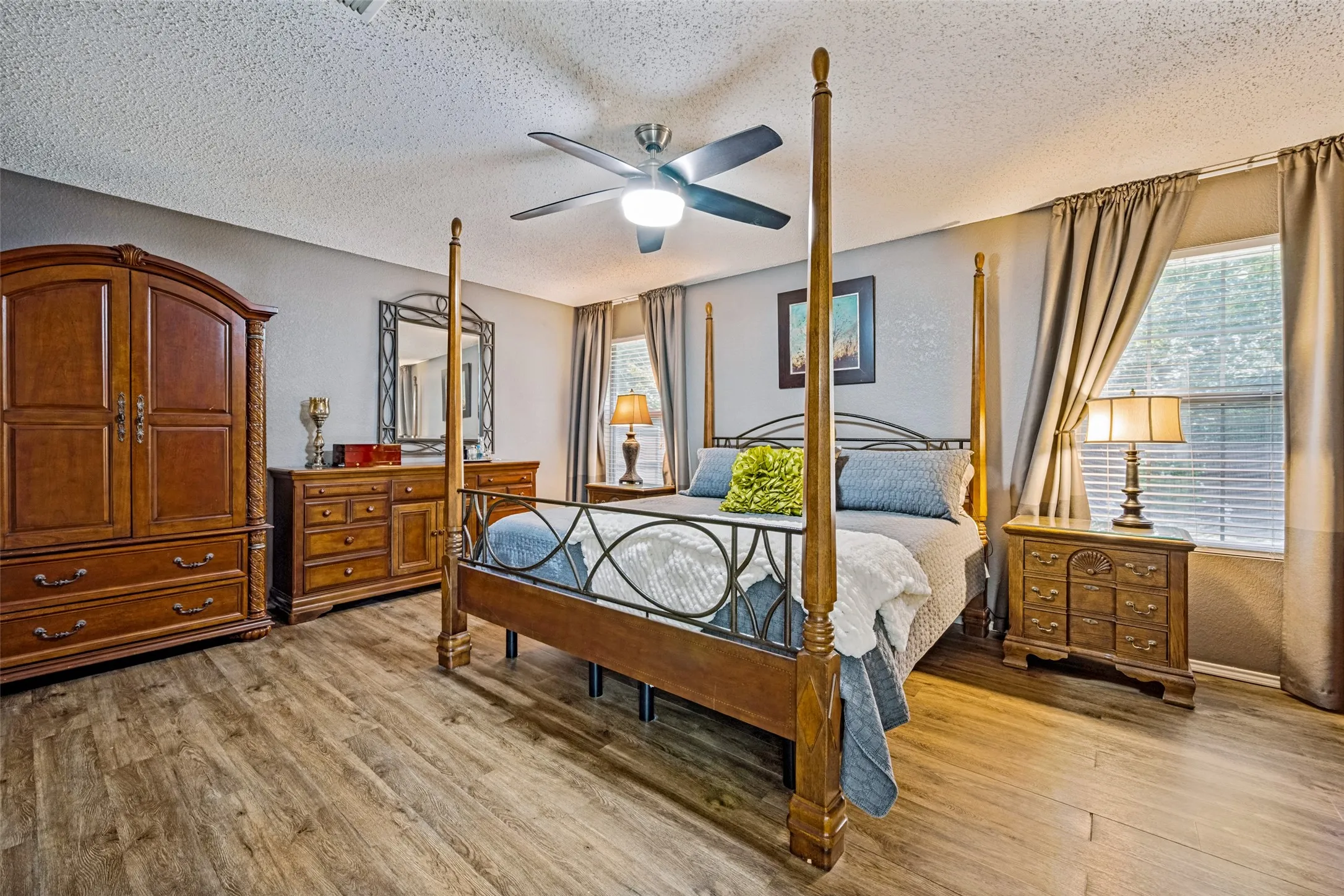 Large Primary Bedroom features luxury vinyl plank flooring and walk-in closet.