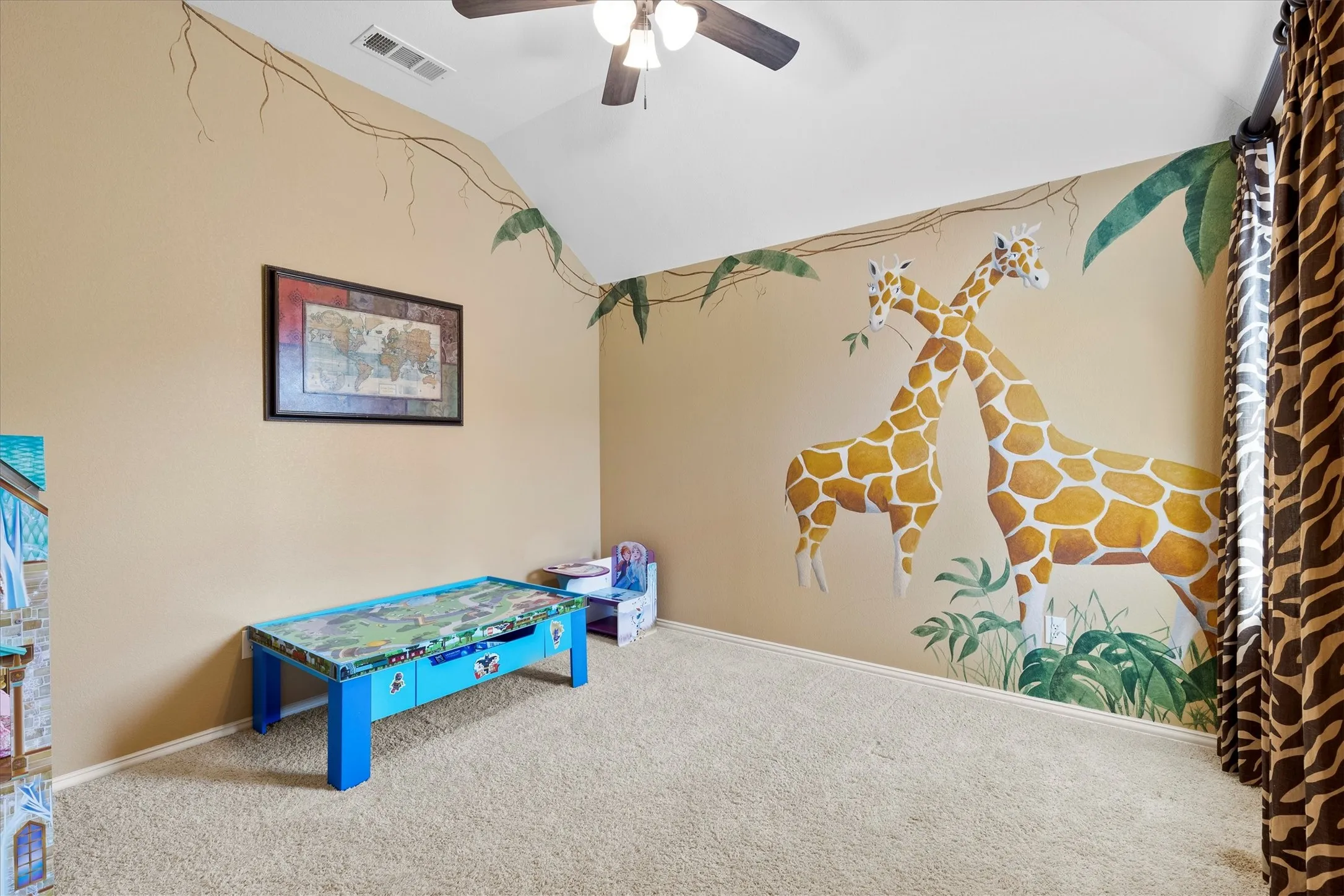 Kid's Bedroom! Giraffe paint and Cheetah head wall mounted.