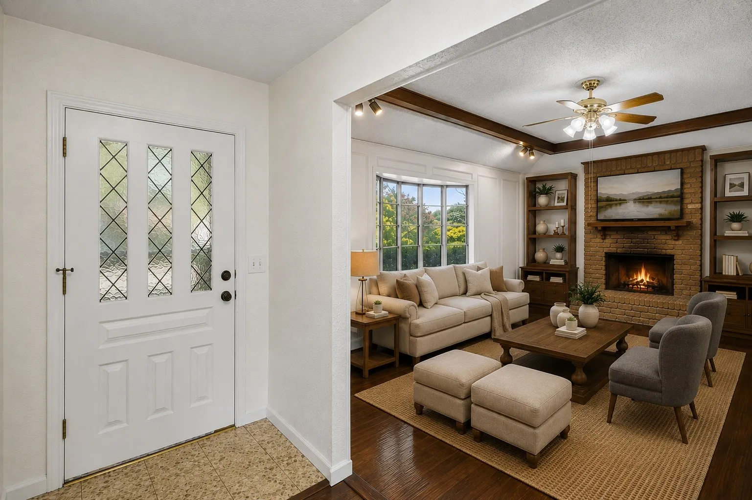 The welcoming entry opens directly into a light-filled family room with hardwood flooring, exposed beams and distinctive architectural character.
Virtually Staged -- original image may have been altered by AI.