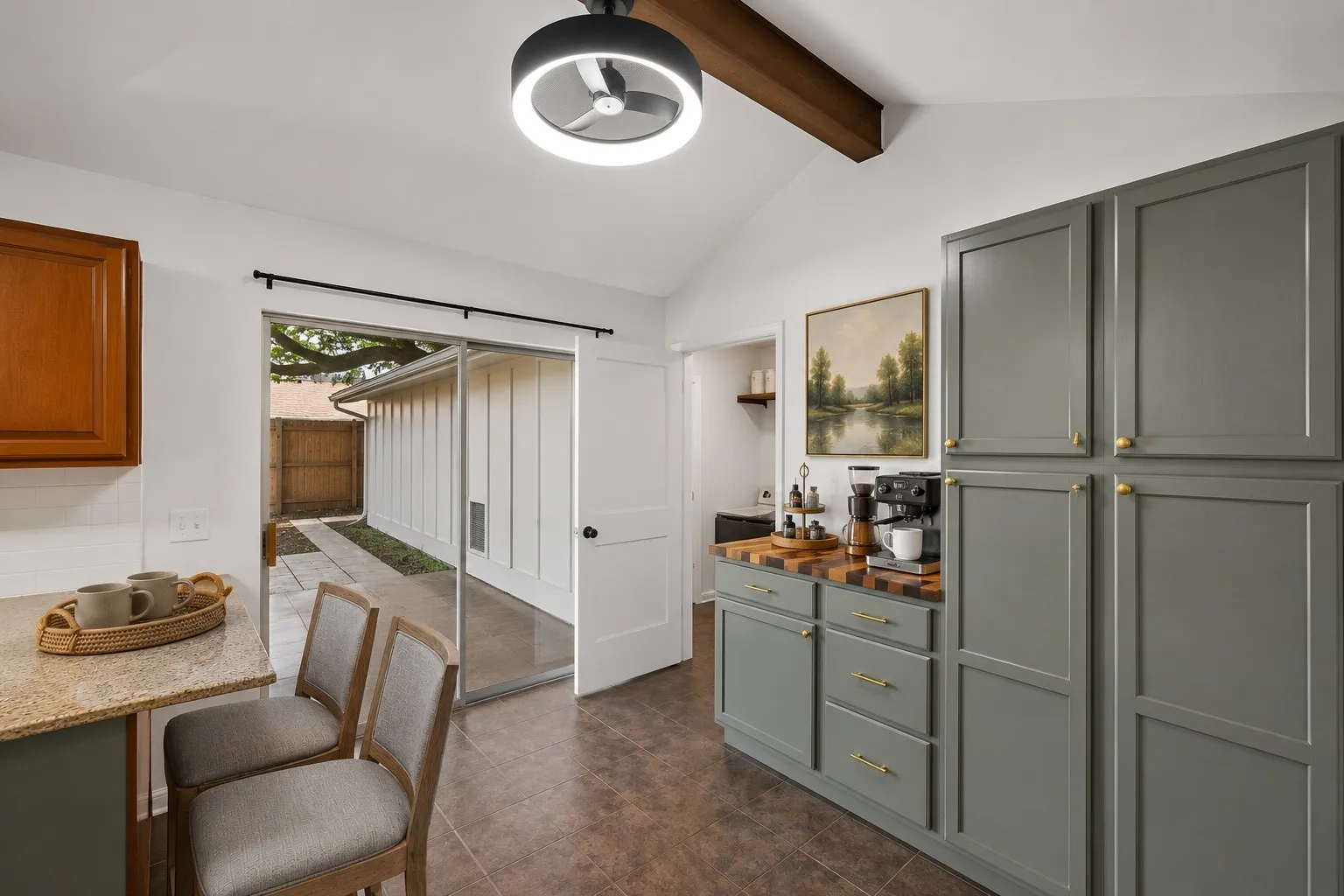 The kitchen opens to the breakfast area and custom built-in coffee bar, creating a convenient and highly functional daily routine.
Virtually Staged -- original image may have been altered by AI.
