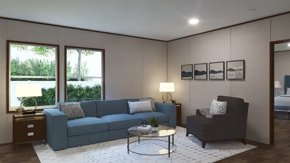 Spacious living area featuring wood-finish flooring, two large windows, recessed ceiling lighting, and a doorway opening to an additional room