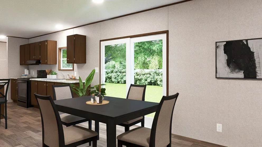 Open-concept dining area featuring wood-finish flooring, recessed lighting, and a sliding glass door to exterior