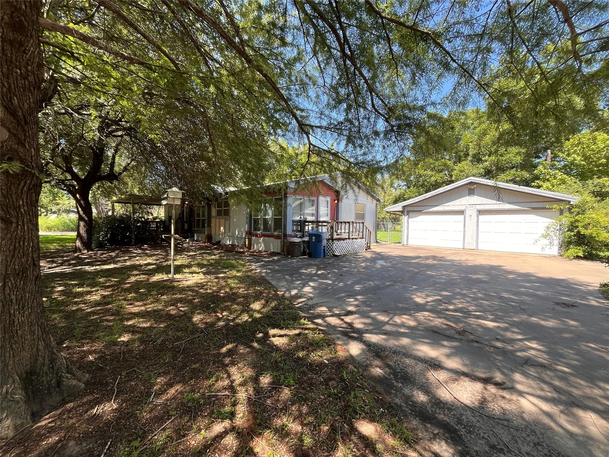 304 S Lafayette is a .2169-acre property with a doublewide for main living, 2-car detached garage, a 1-car detached workshop with office, and a 10'x20' shed on a cement slab