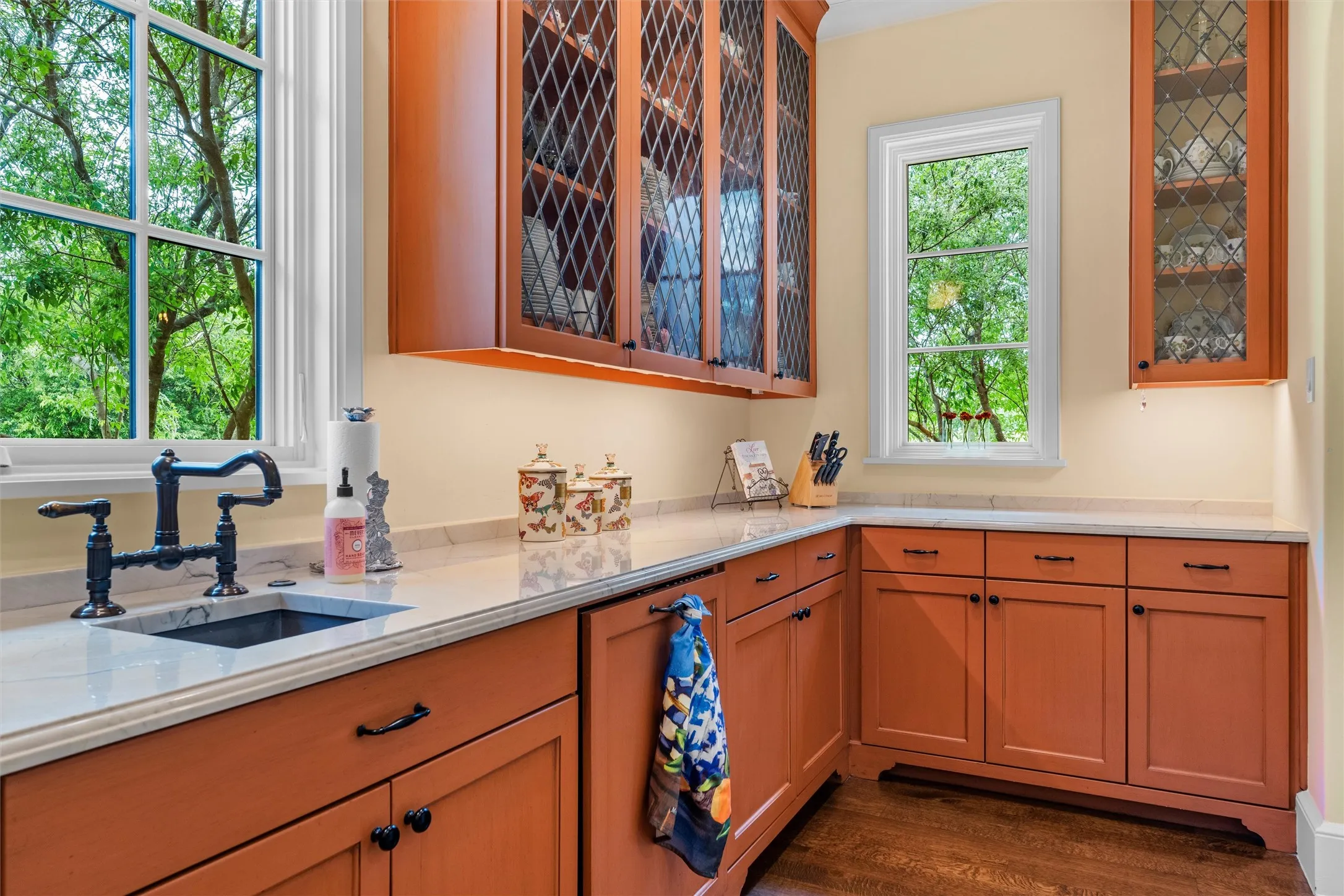 The large butler's panty provides abundant cabinet and counter space, enough for a crew to cater your gatherings.