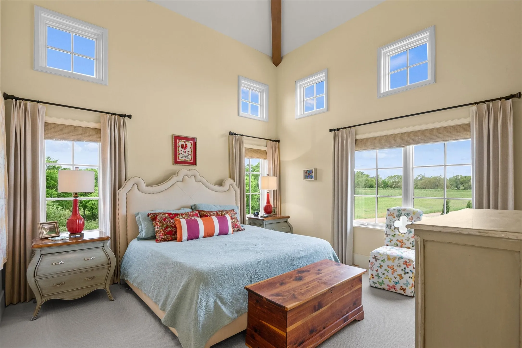The second floor guest wing includes a large, private and unique guest bedroom with tons of natural light .