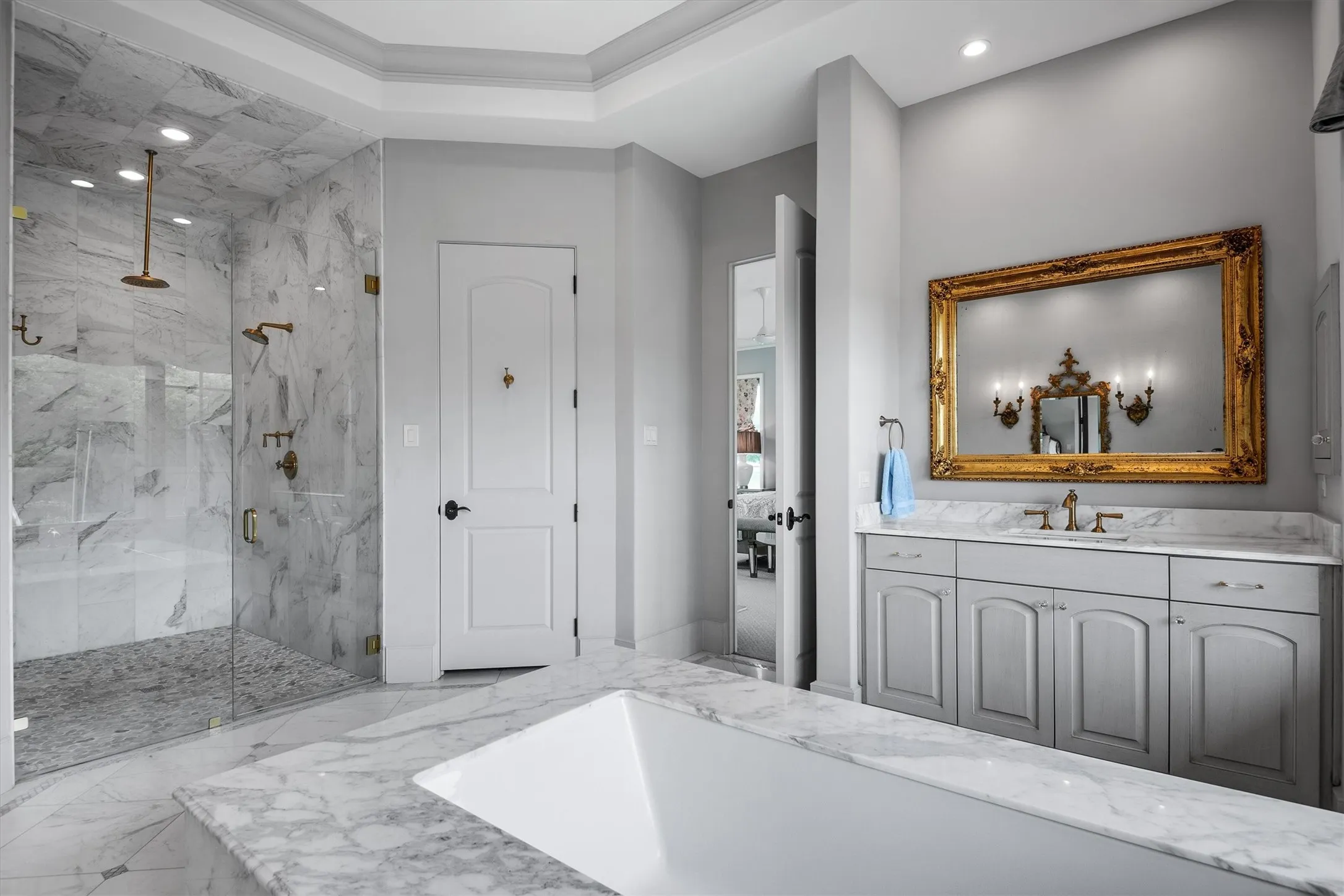 Enormous primary bathroom with designer curvature tray ceiling completed the highest level of design from top to bottom.