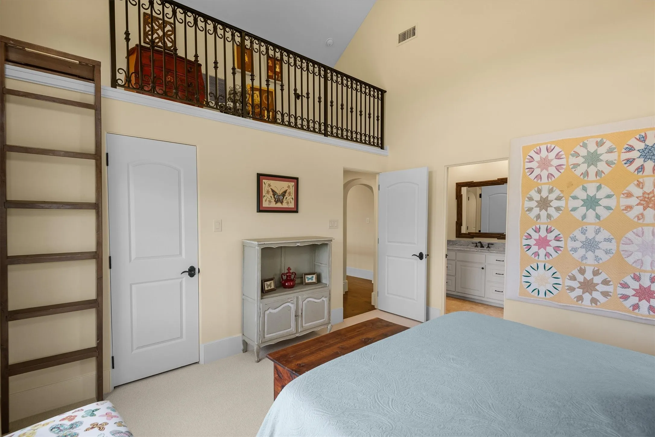 The guest bedroom enjoys a small loft area and an ensuite bath.