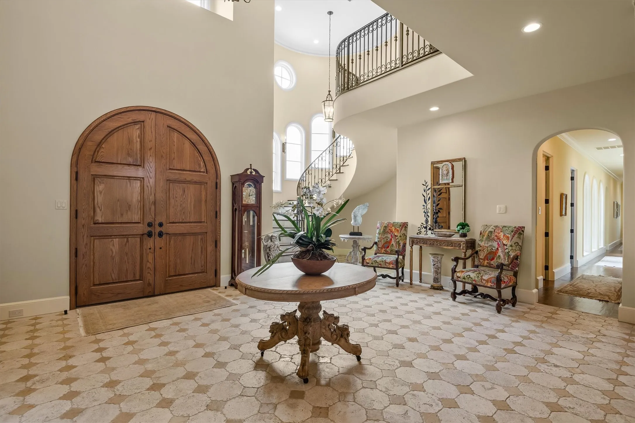 The dramatic entry welcomes your guests with a two story ceiling, and a curved stairwell ensconced in the castle's turret.