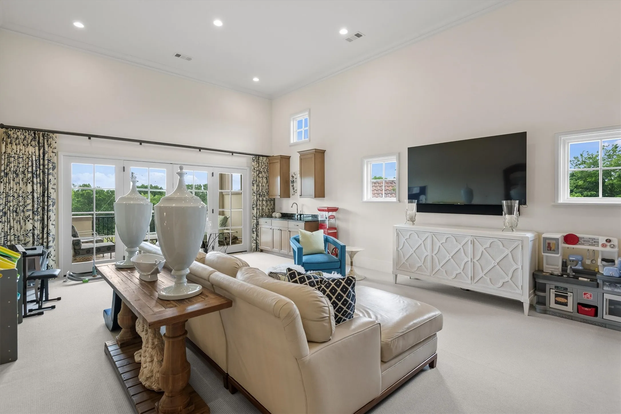 The family room is luxurious enough for the most discriminating guests to relax or room for kids to enjoy gaming.