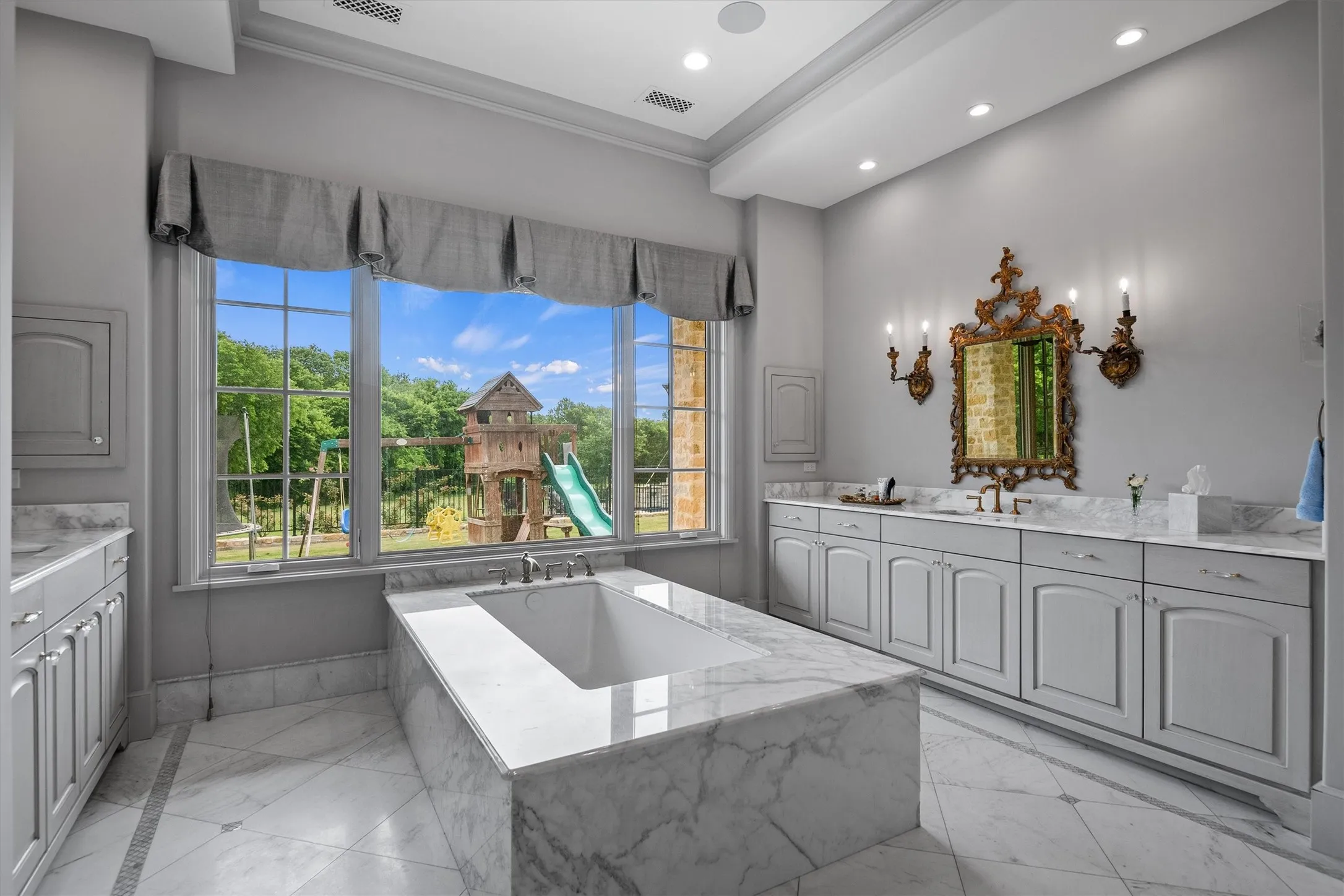 Step inside the most luxurious marble encased bathtub surrounded by natural light.