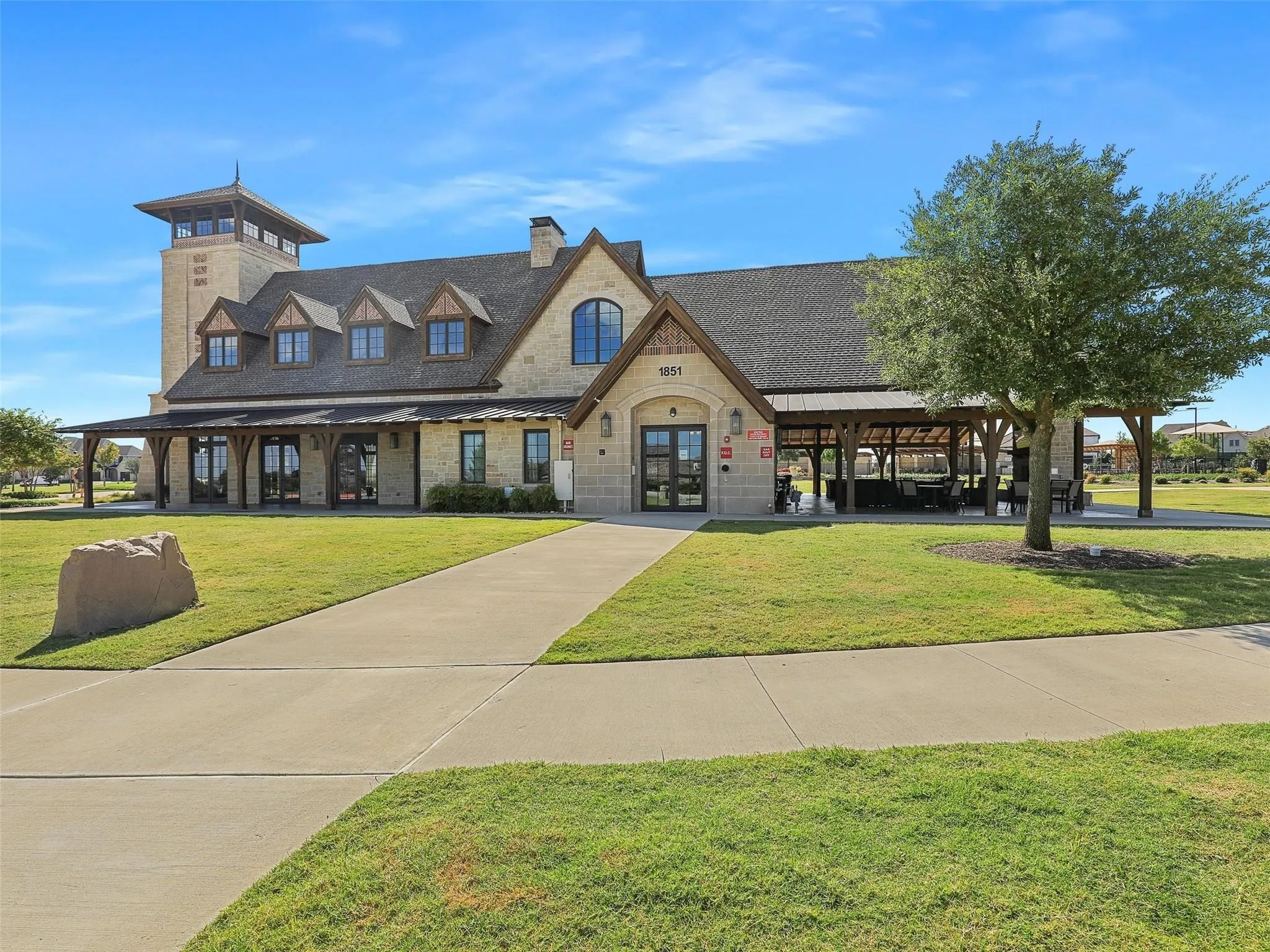 Star Trail Clubhouse and Amenity Center featuring a clubhouse, multiple pools, tennis and pickleball courts and a great playground for the kids!