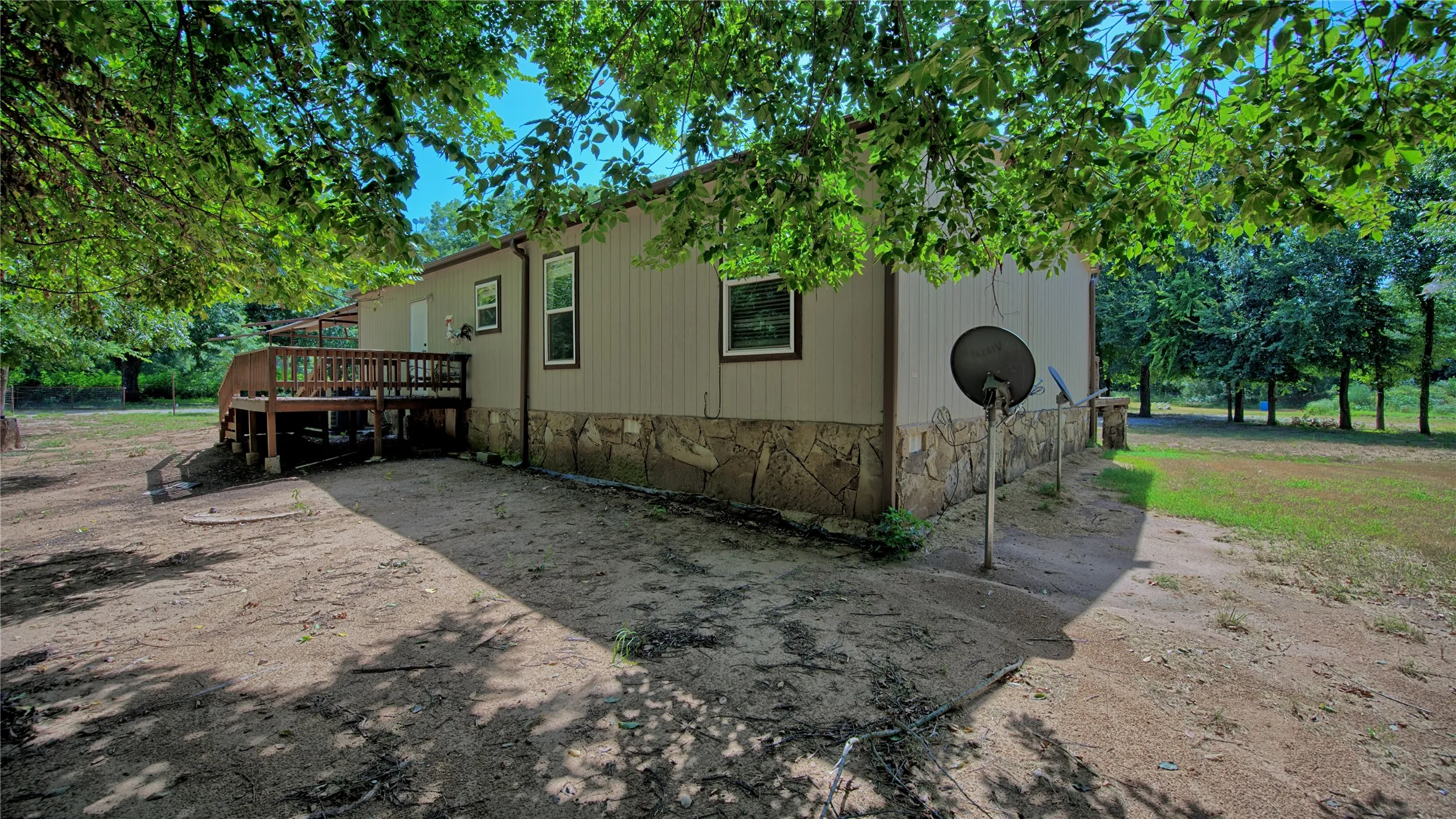 Backside features sm back deck area & rock skirting