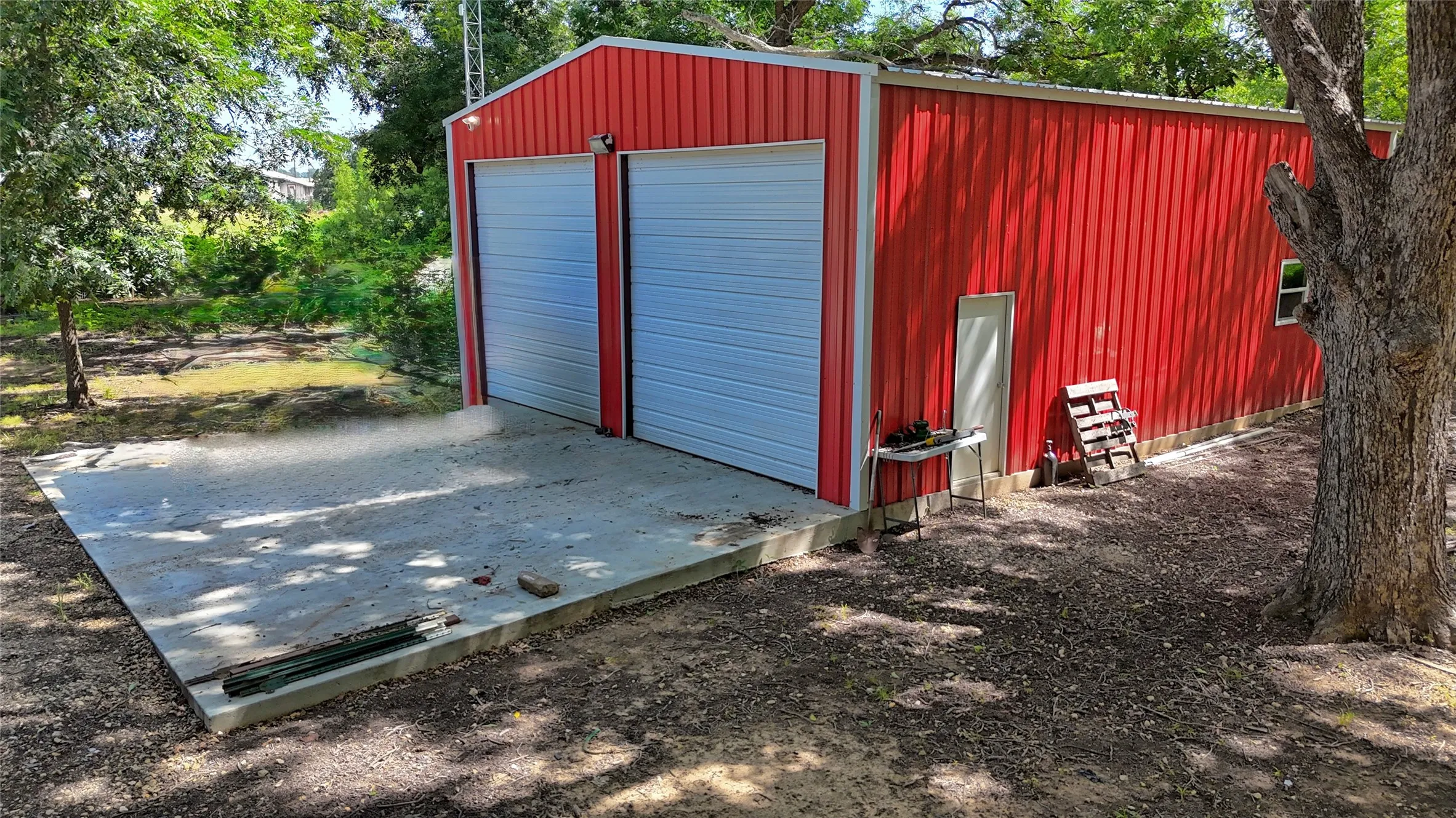 30x40 shop features 2 12ft automatic roll up doors and 50amp RV hook up service