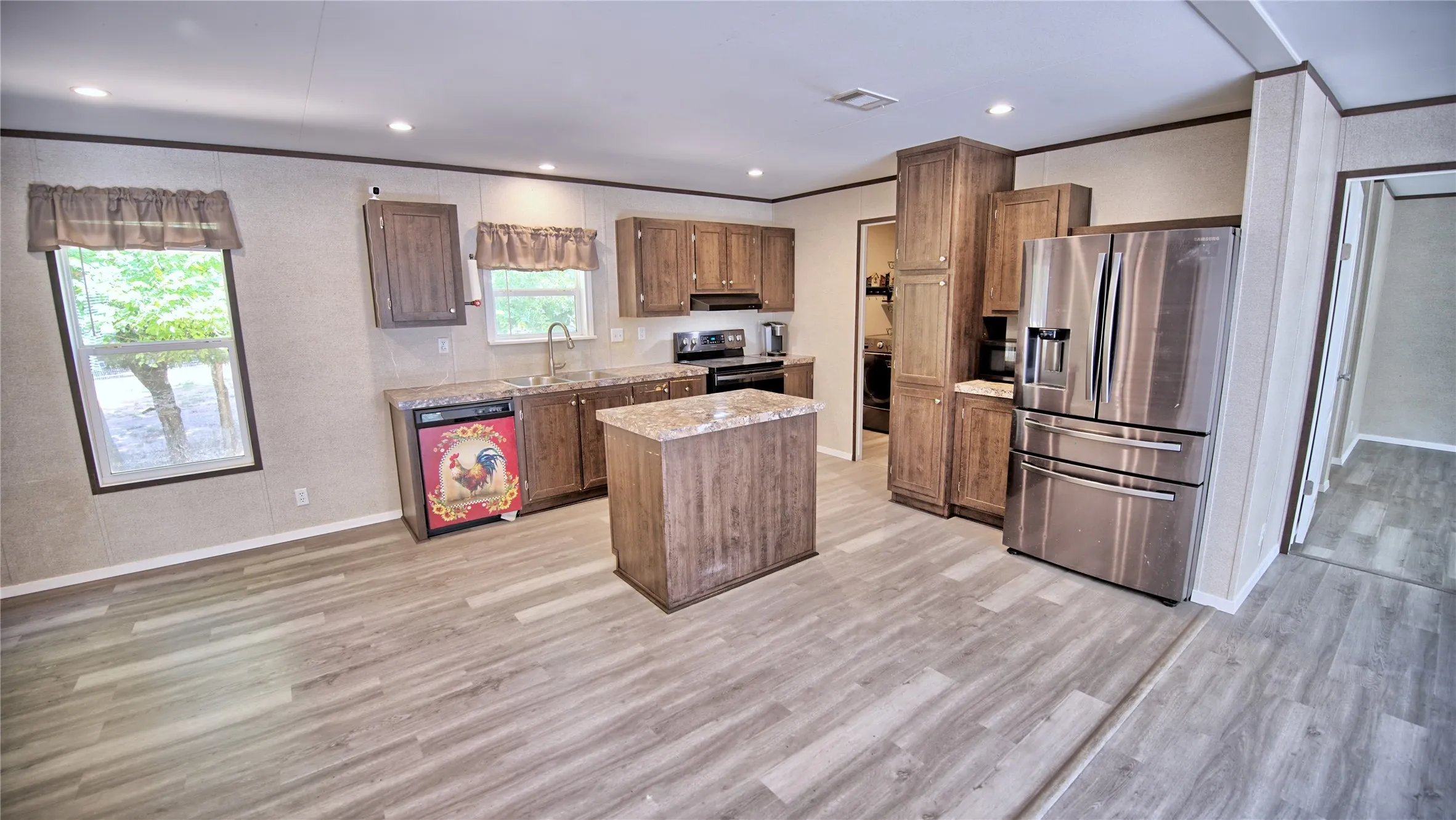 Separate dining area and small island. Refrigerator will stay
