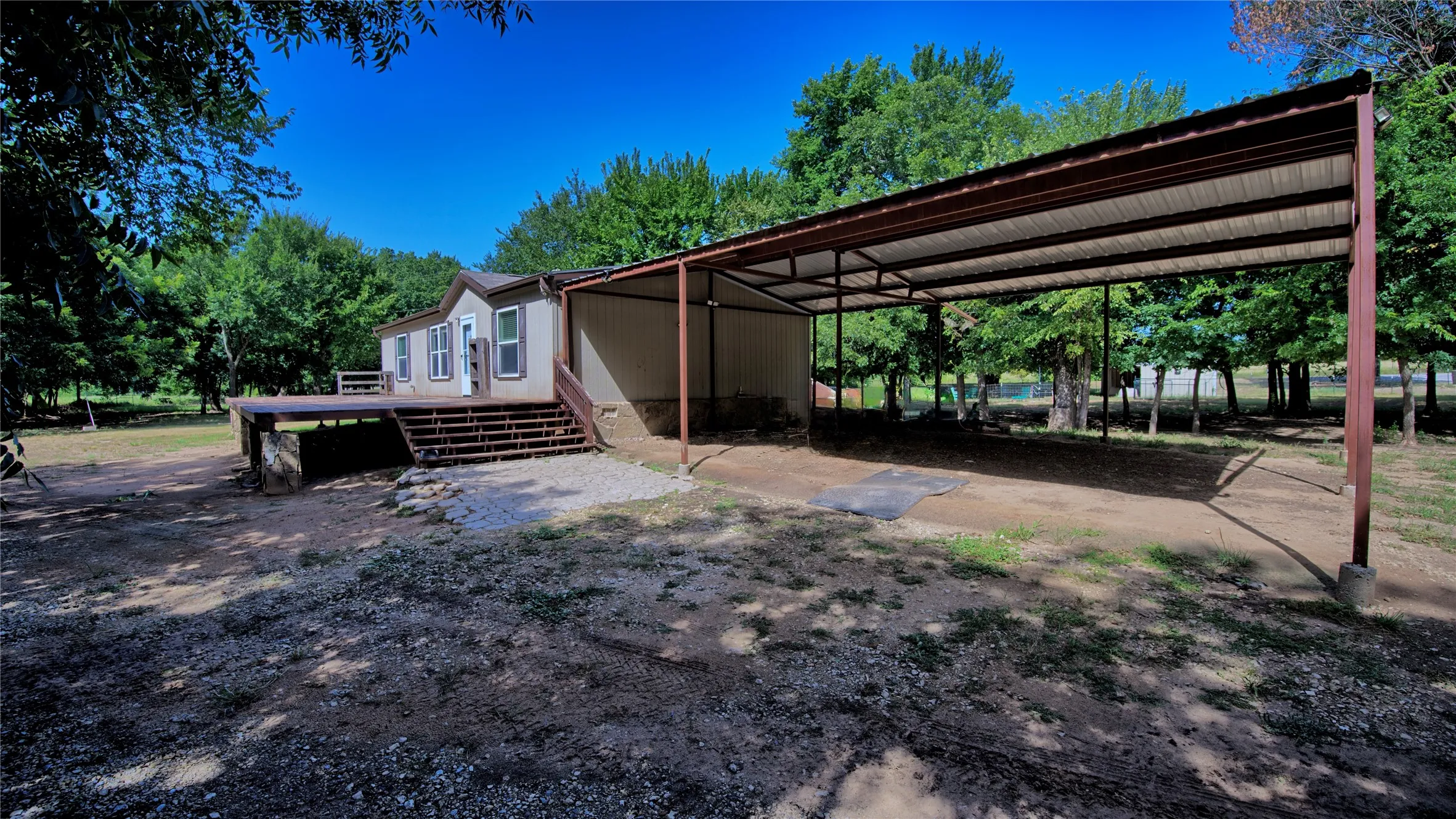 Easily accommodates 4 vehicles under the attached carport