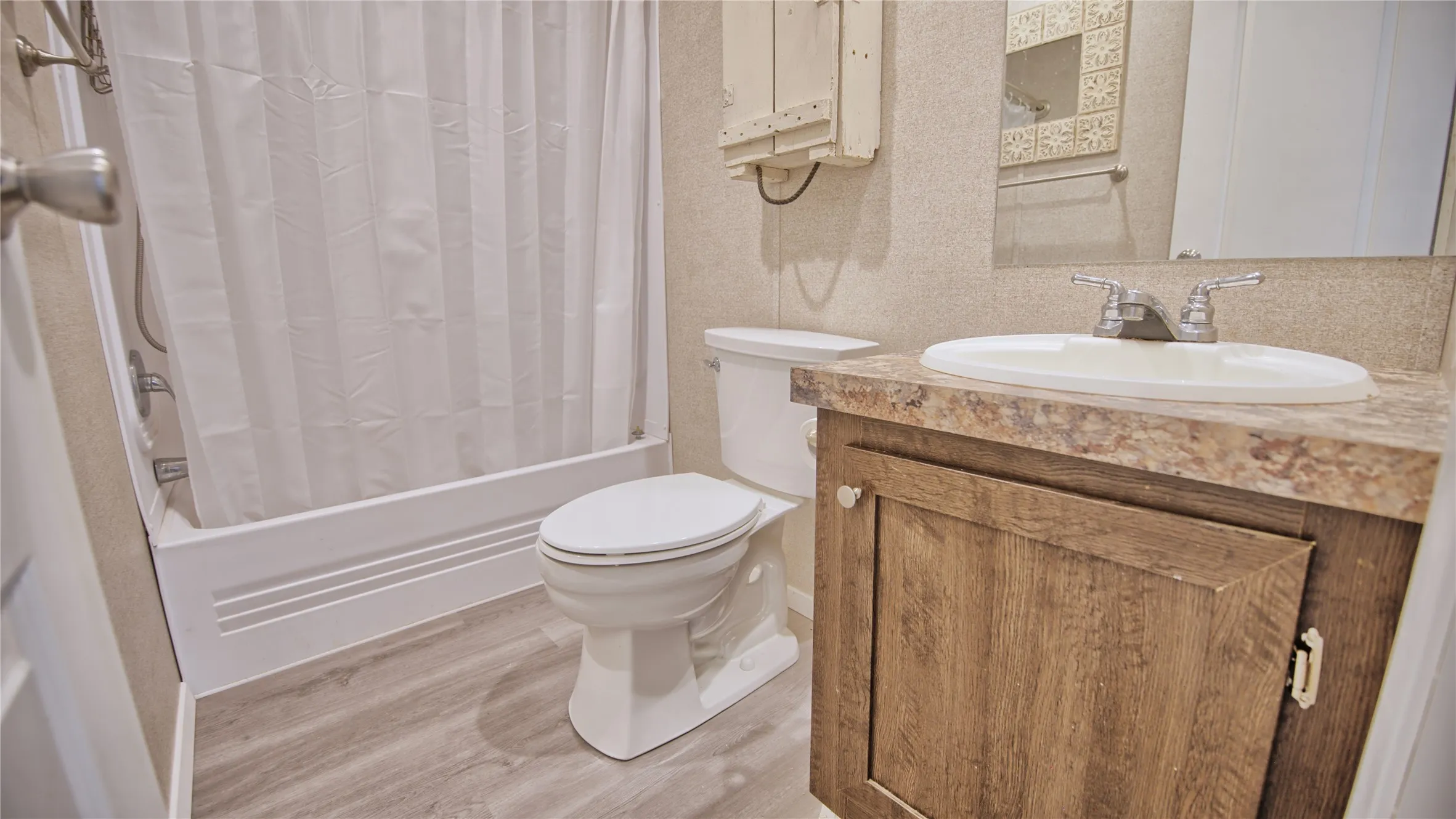 Guest Bathroom features tub shower combo