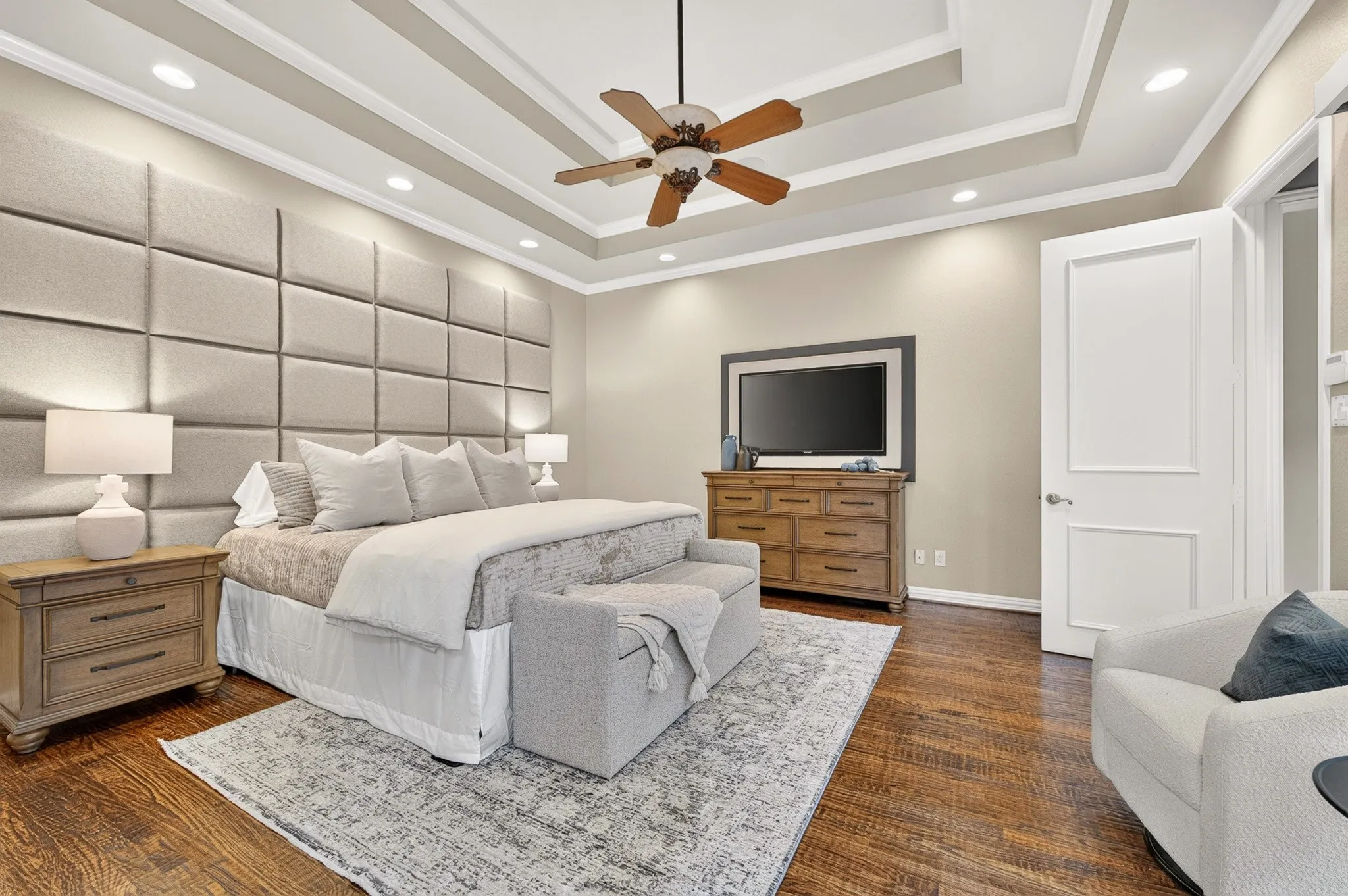 Tray ceiling with recessed lighting and crown molding
