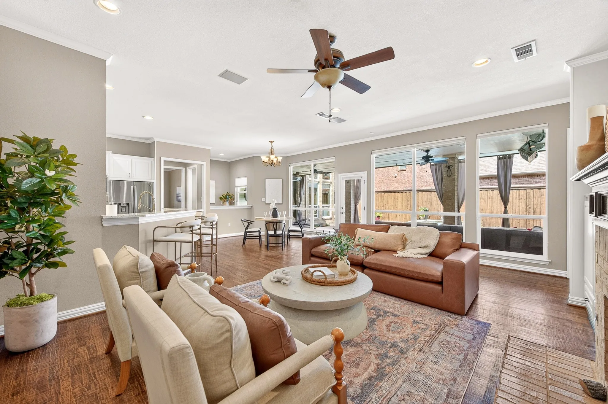 Wood-finish flooring throughout, recessed lighting, and a ceiling fan