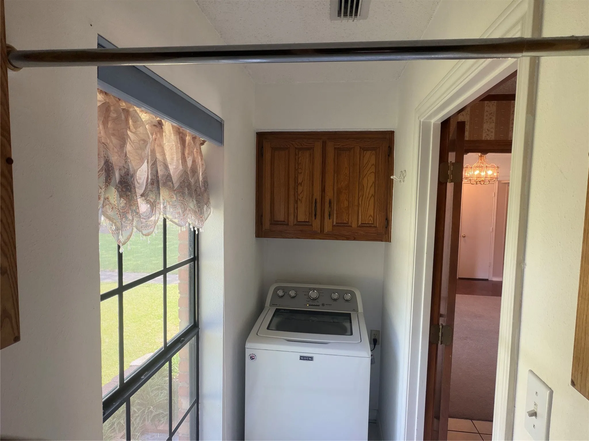 Full size washer, across from full size dryer