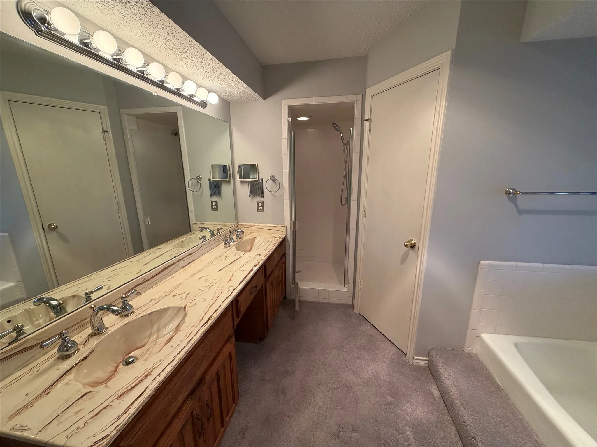 dual sinks, garden tub, walk in shower, separate walk-in closets