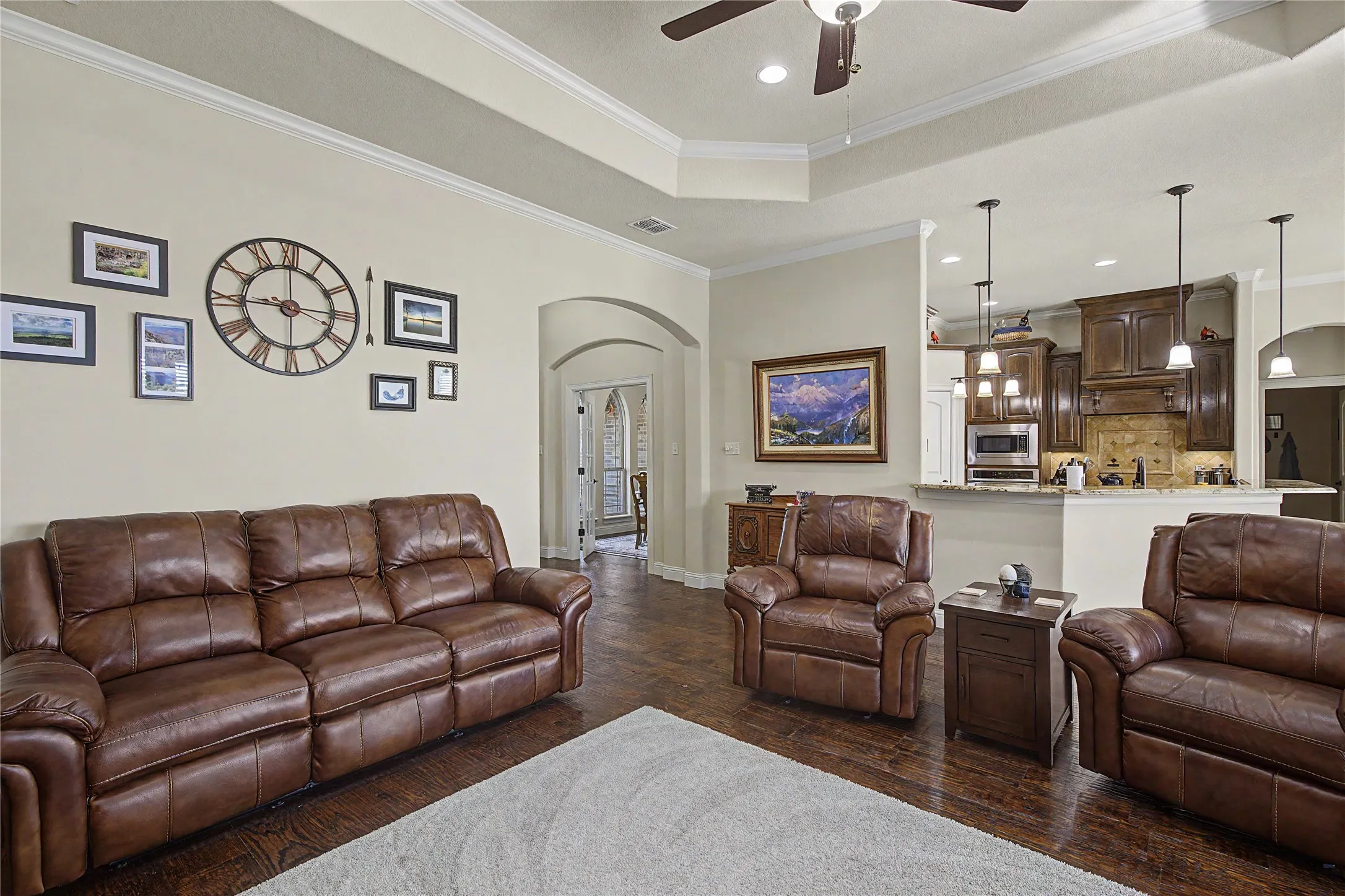 Open floor plan in living, kitchen, and dining space