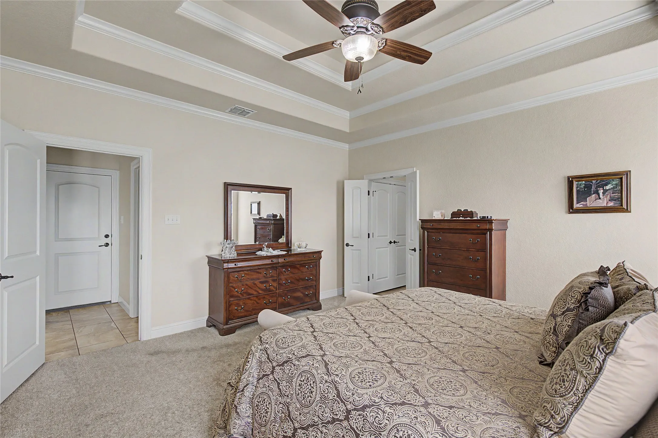 Double doors lead to luxurious ensuite bathroom