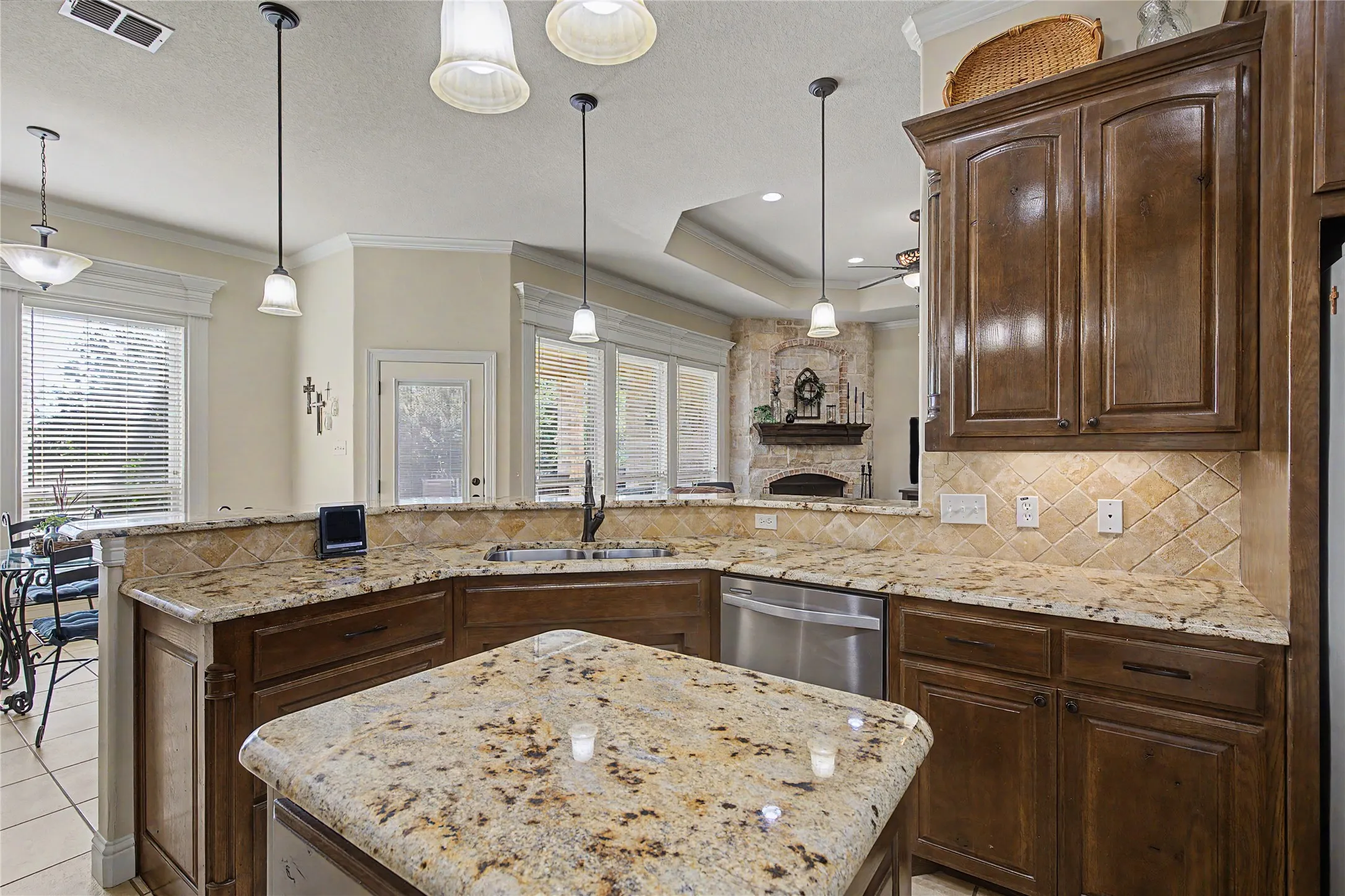 Kitchen island with granite countertop and breakfast bar