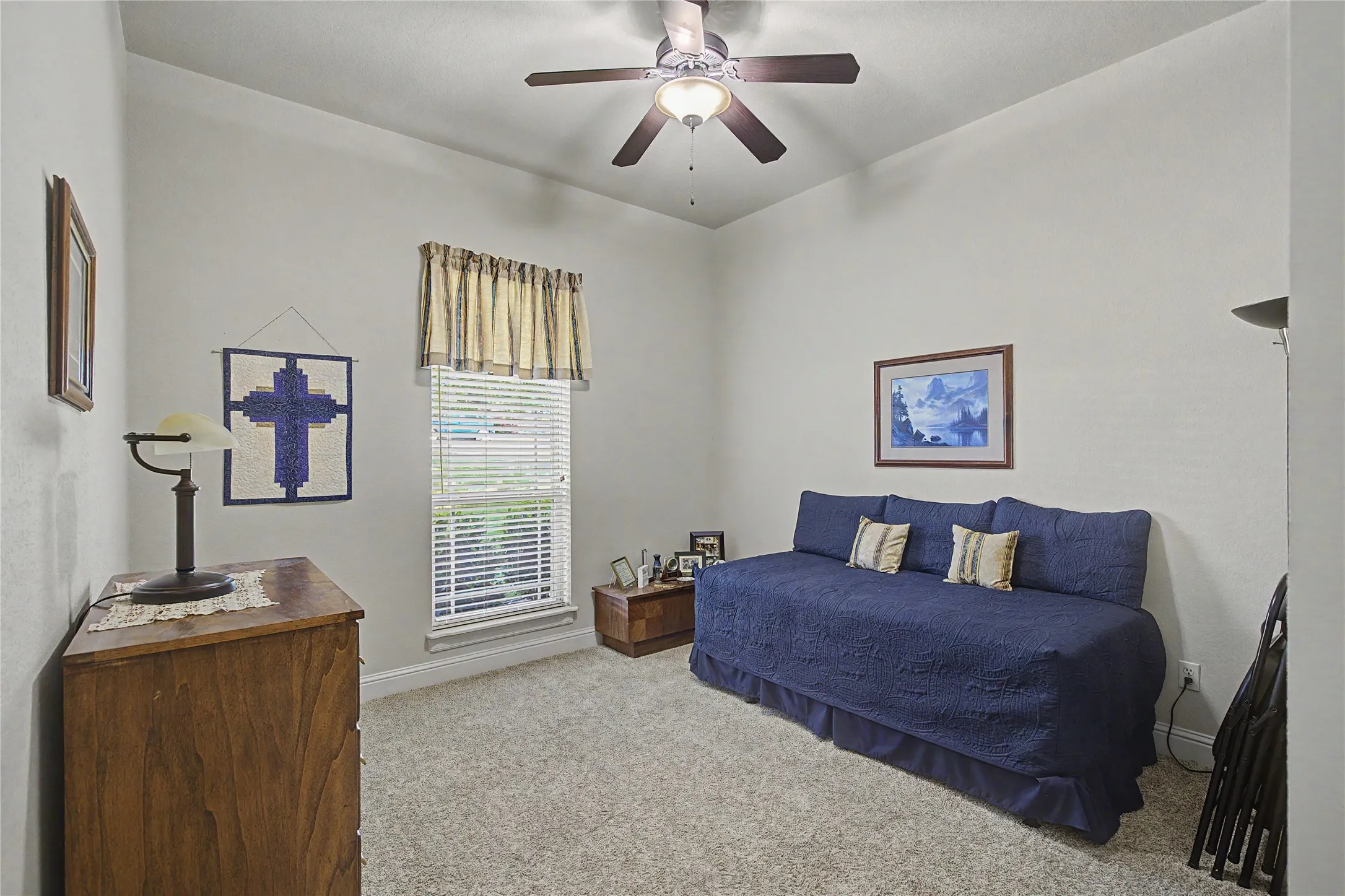 3 guest bedrooms feature ceiling fans and lush carpet