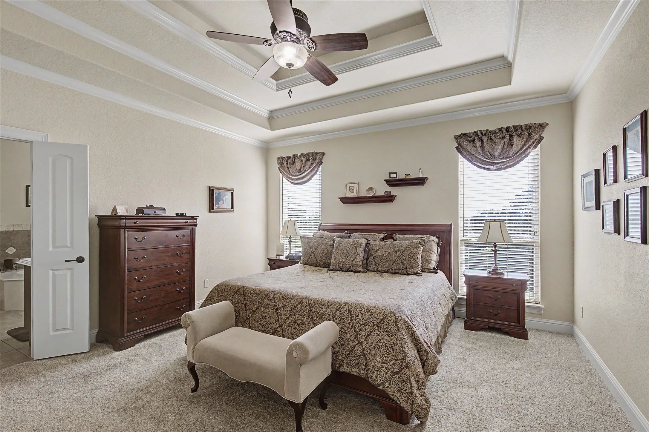 Dramatic Tray ceiling in primary bedroom