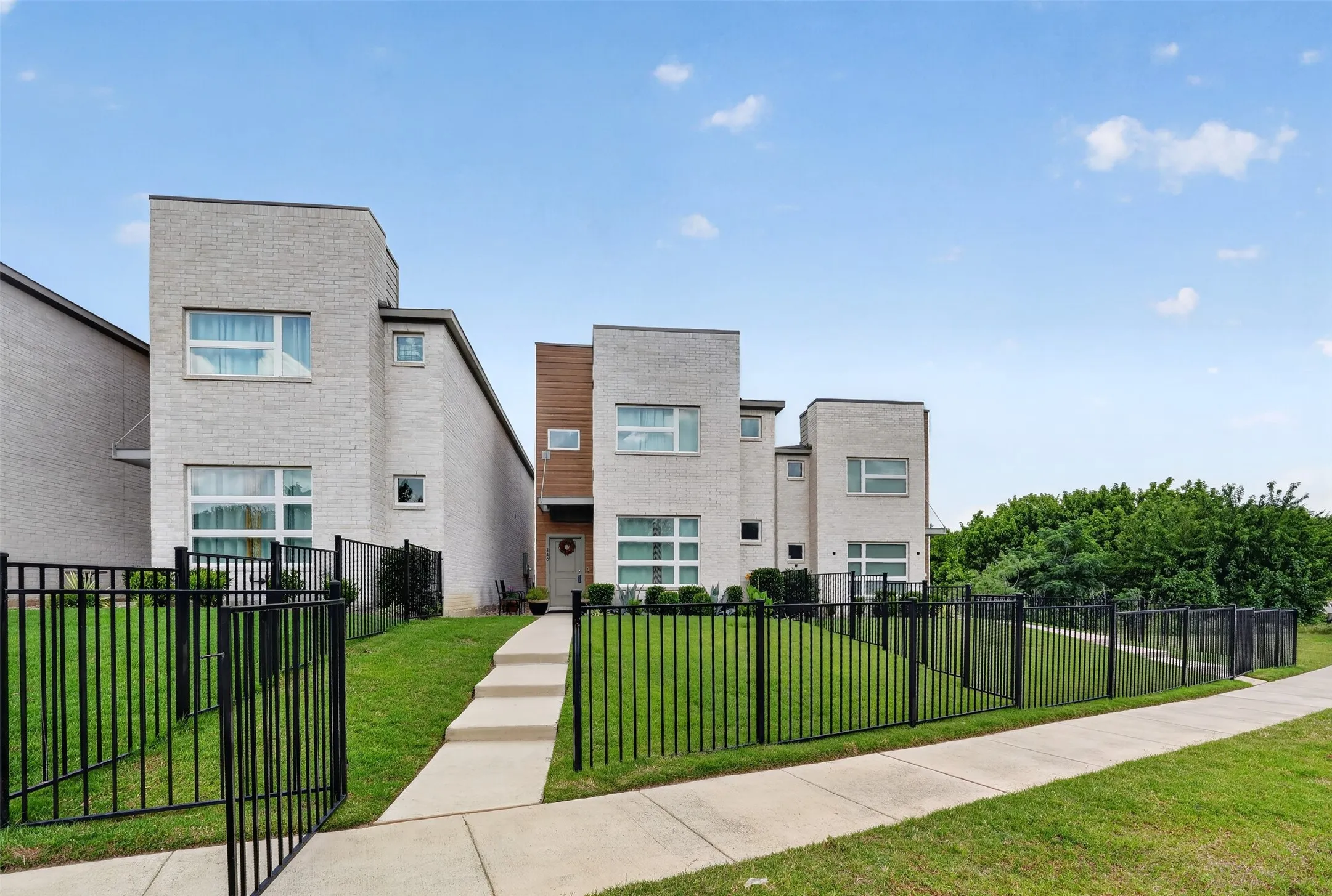 Gated front yard offering added privacy and a welcoming entrance.
