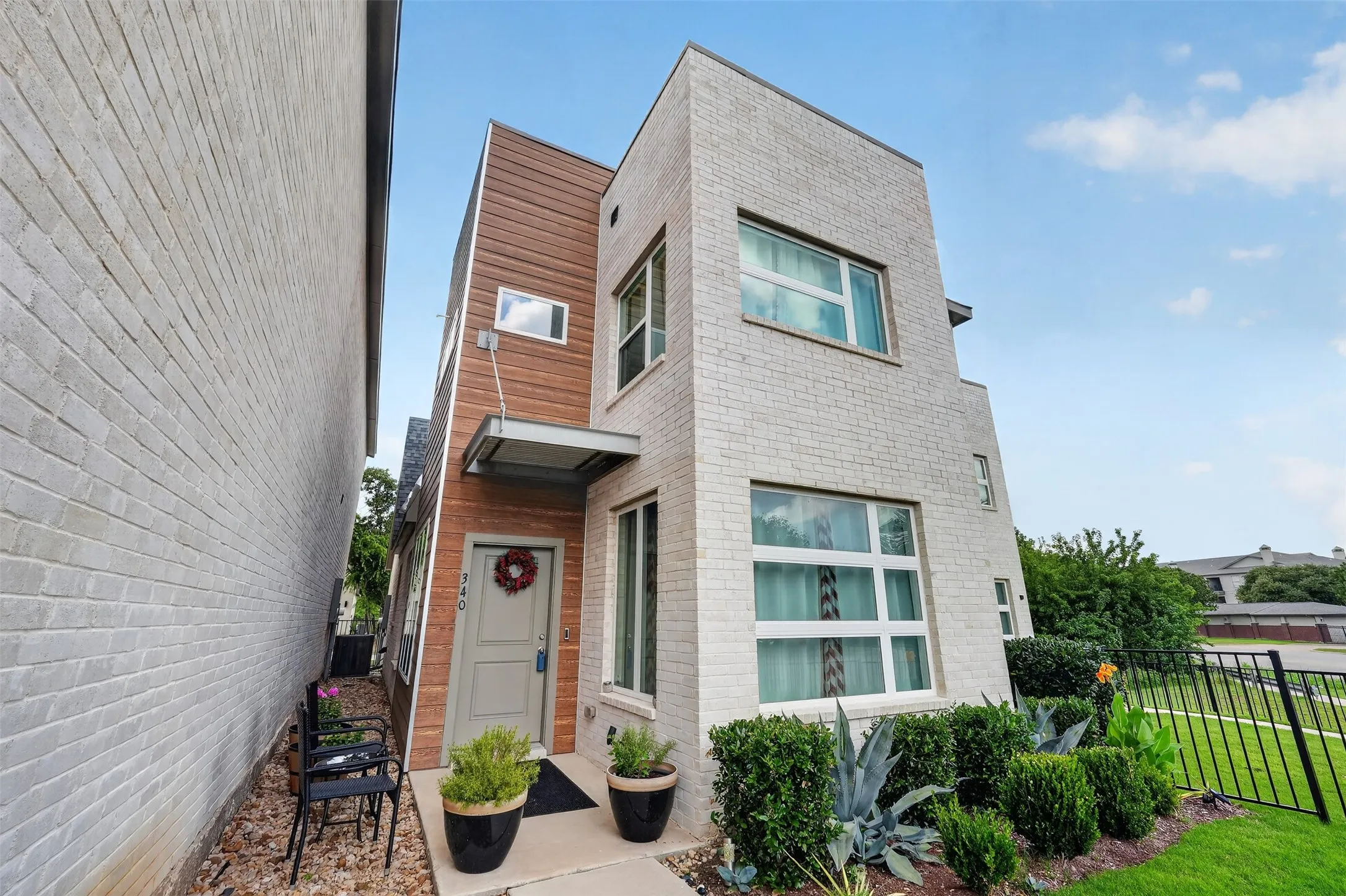 Beautifully maintained exterior with mature landscaping and a welcoming entry.