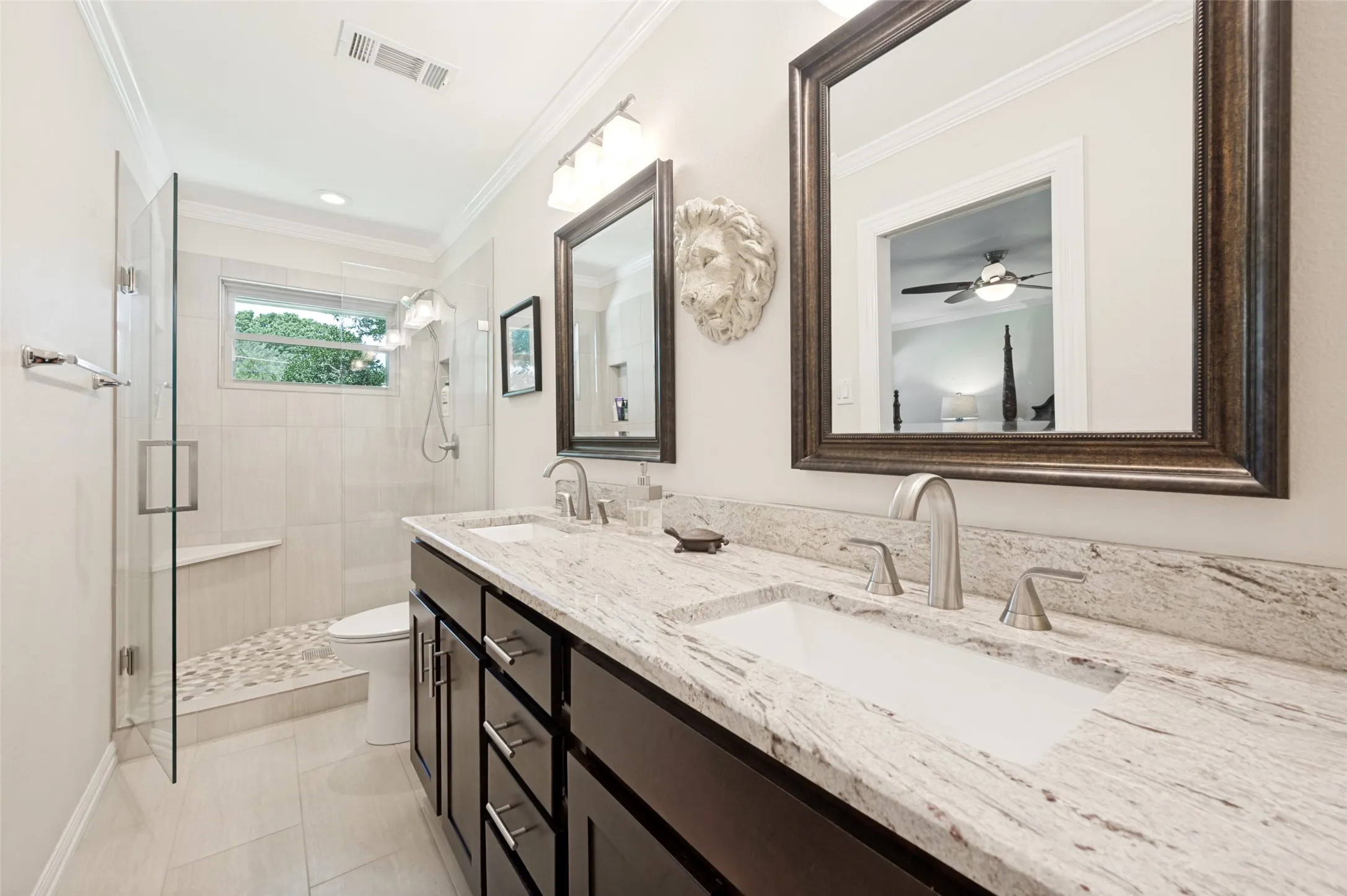 Dual vanity with under-mount sinks and stone countertops