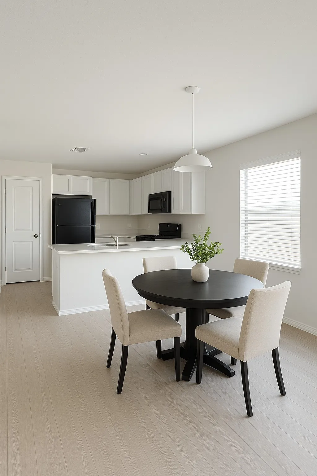 Dining space with light wood-style floors and baseboards