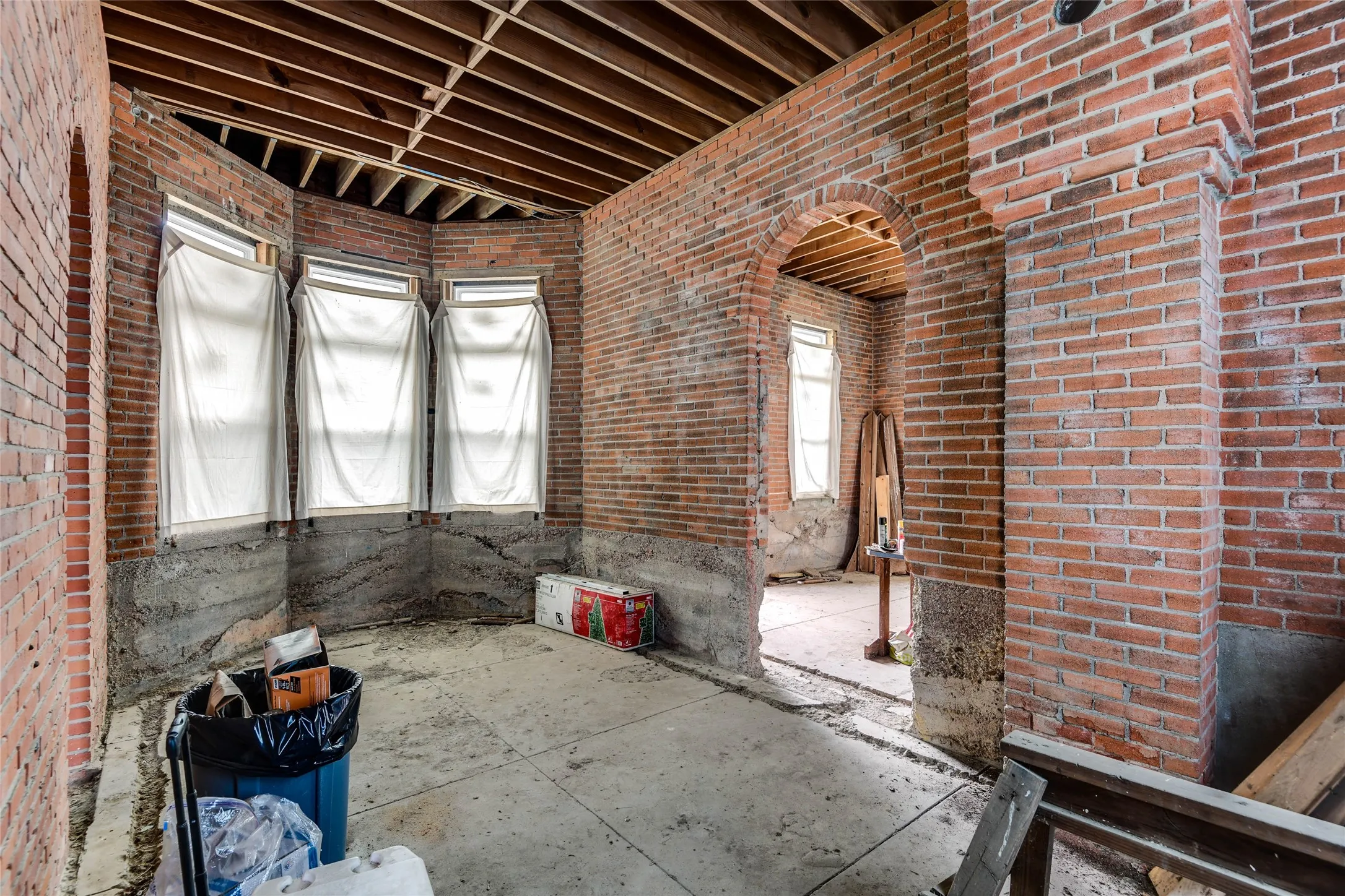 Misc room featuring brick wall